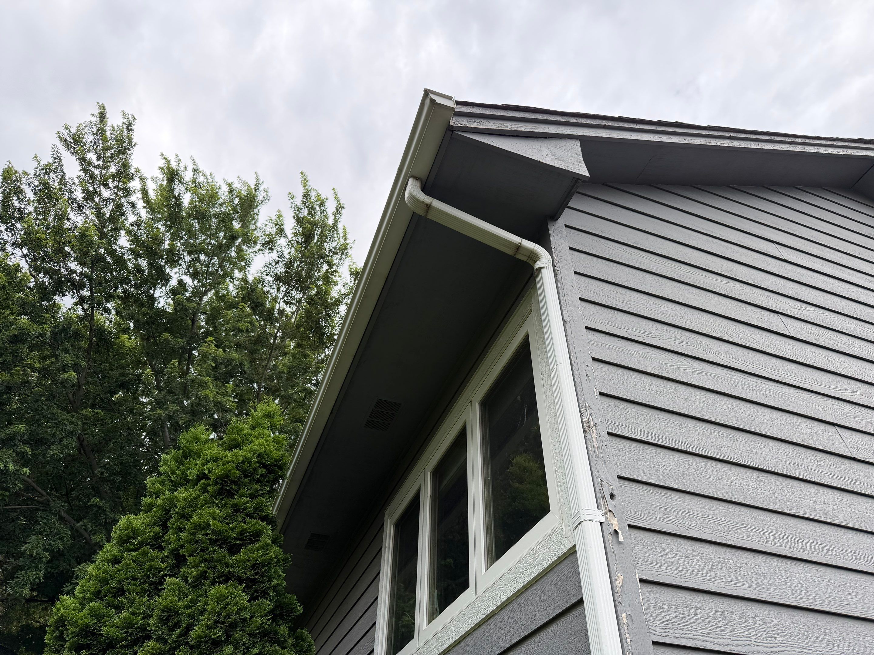 Full Exterior Painting for Gray Siding and Trim in Sioux Falls by Select Painting, Coatings & Garage Cabinets