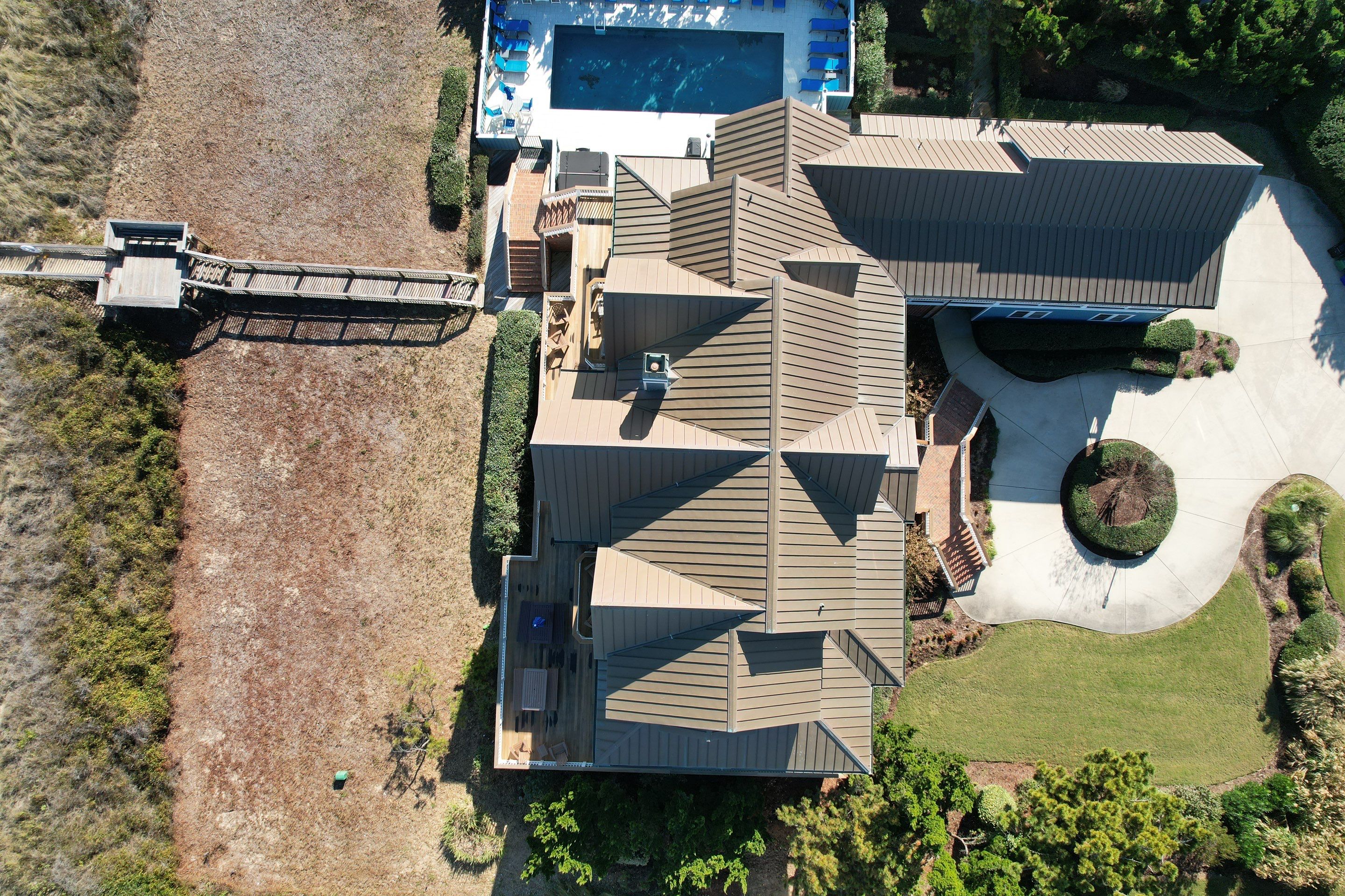 Large Metal Roof Transformation by Gallop Roofing & Remodeling, Inc.