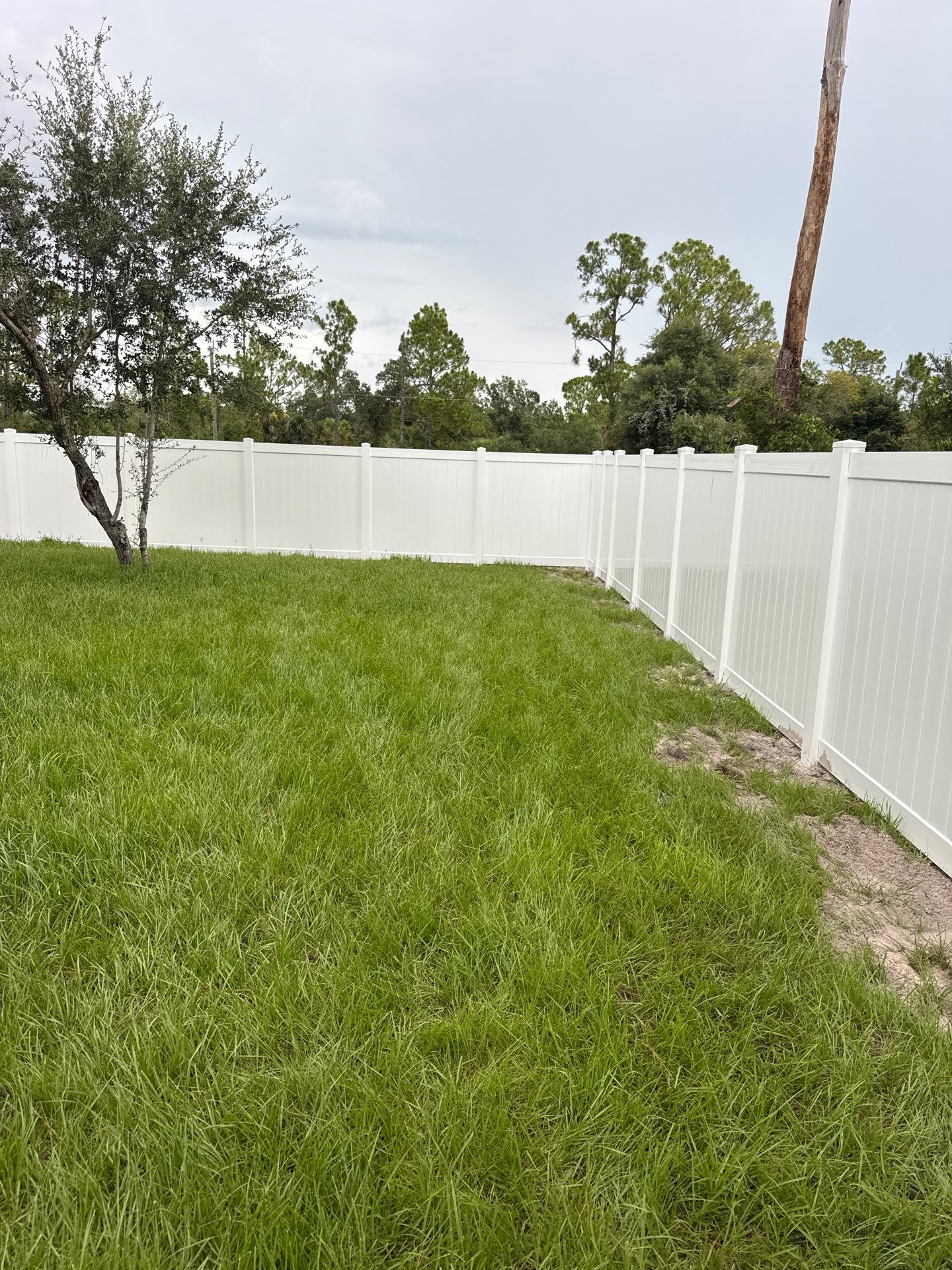 White Vinyl Privacy Fence Installation in North Port by True Fence LLC