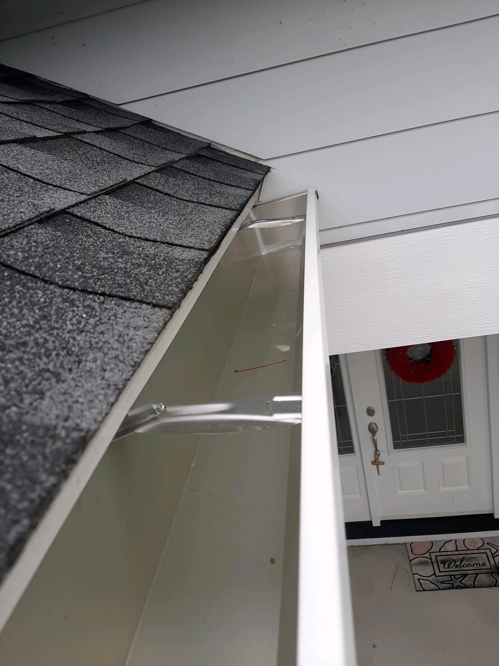 Gutter Installation using White K-Style Seamless Gutters by Gutter Professors