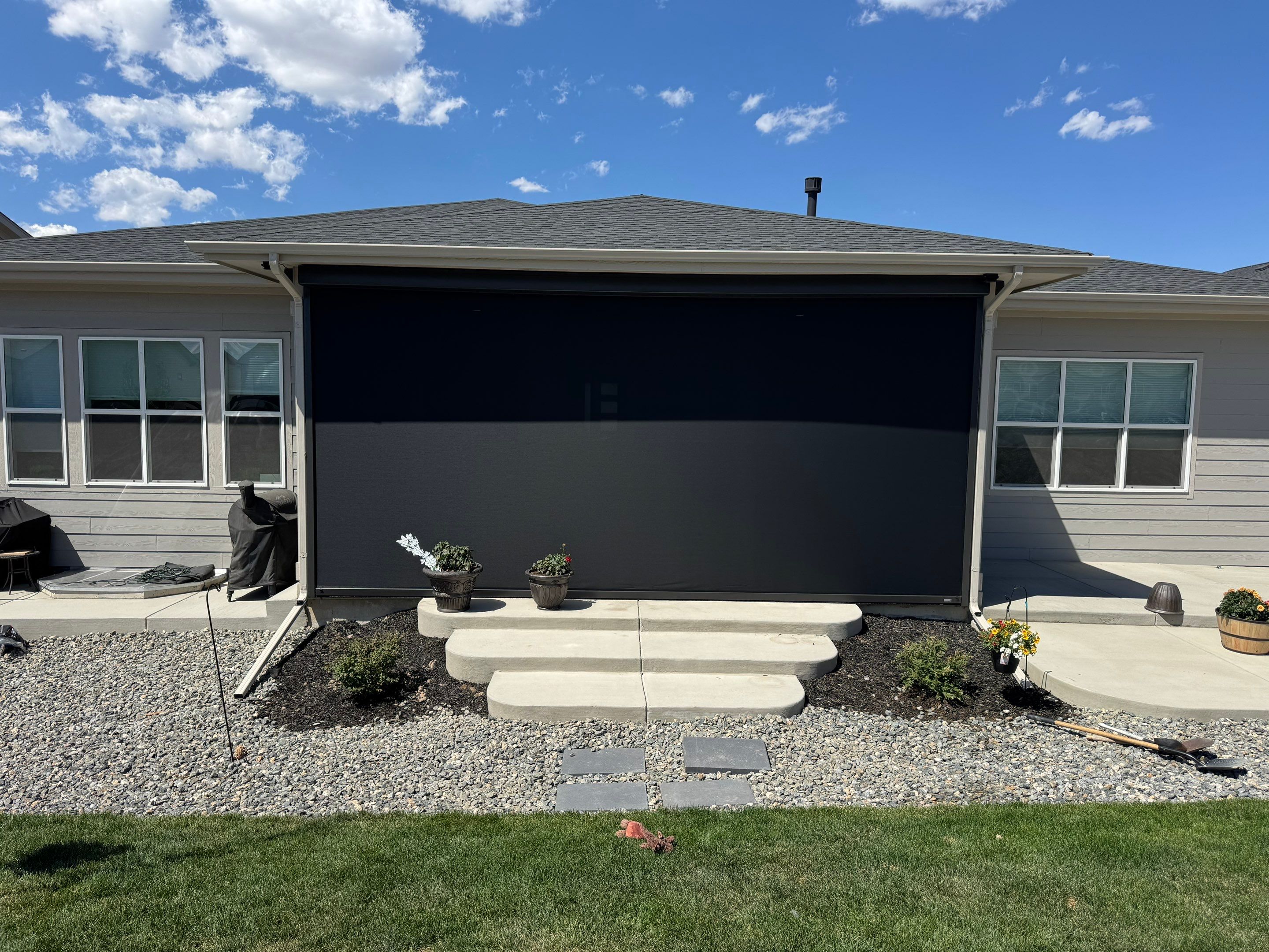 Retractable All-Weather Screen Installation for Castle Rock Covered Patio by Outdoor Solutions Colorado