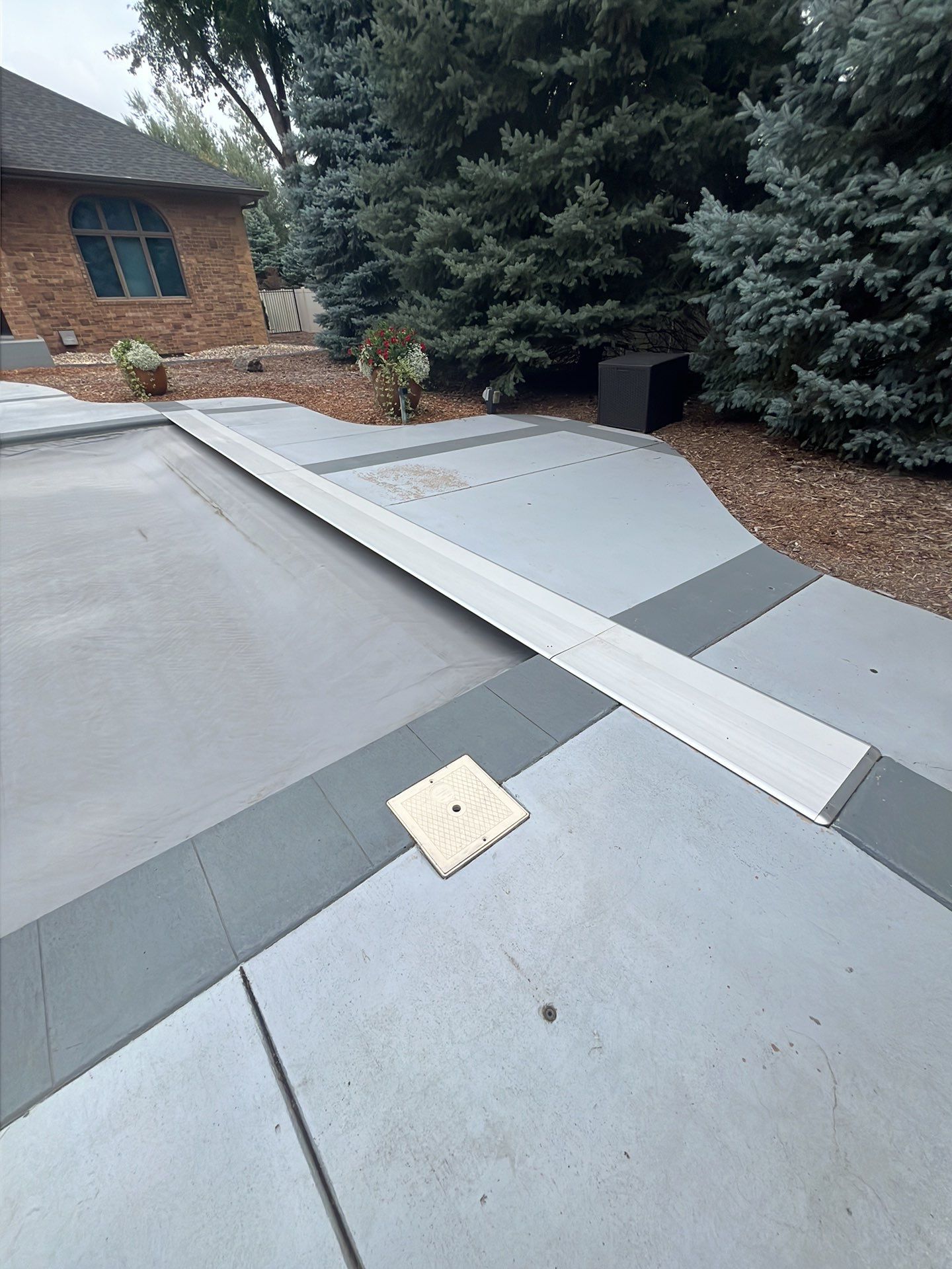 Decorative Concrete Pool Deck and Patio Resurfacing in Sioux Falls by Select Painting, Coatings & Garage Cabinets