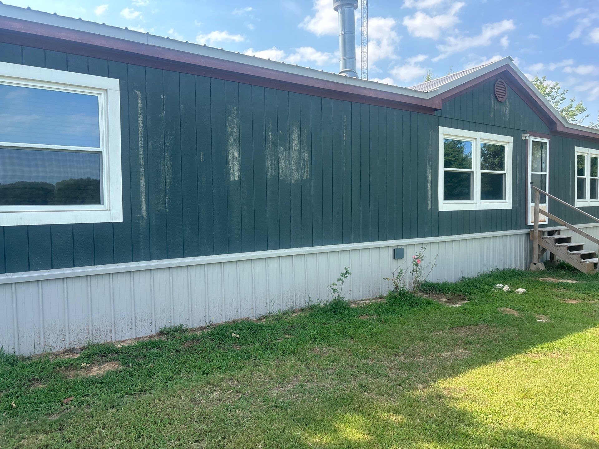Exterior Painting in Fruitvale, TX | Wood Porch & Home in Deep Navy Blue by Quality Coats Painting