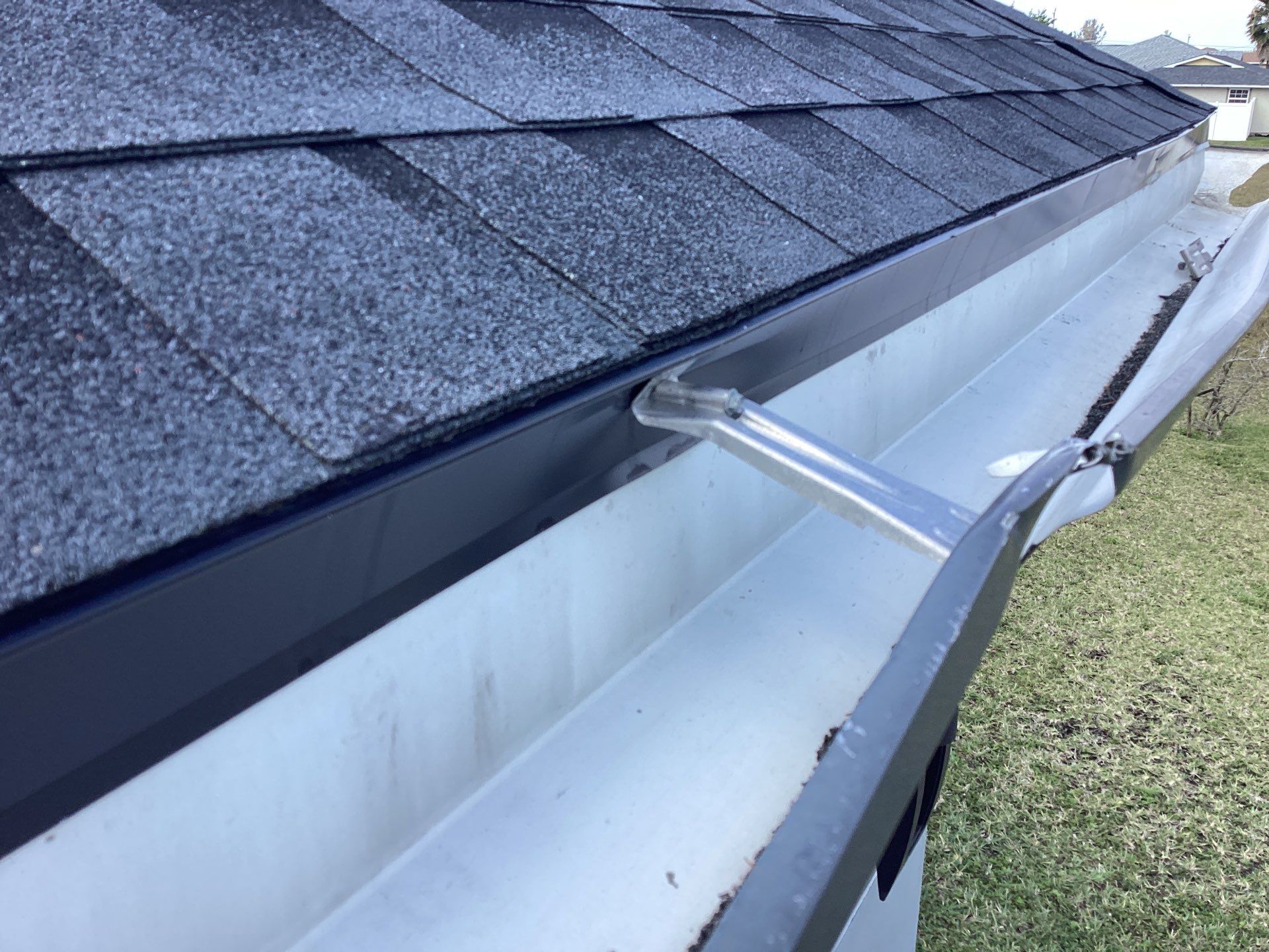 Black Seamless Gutters using 6 Inch Seamless Gutters in Cape Coral FL by Gutter Professors