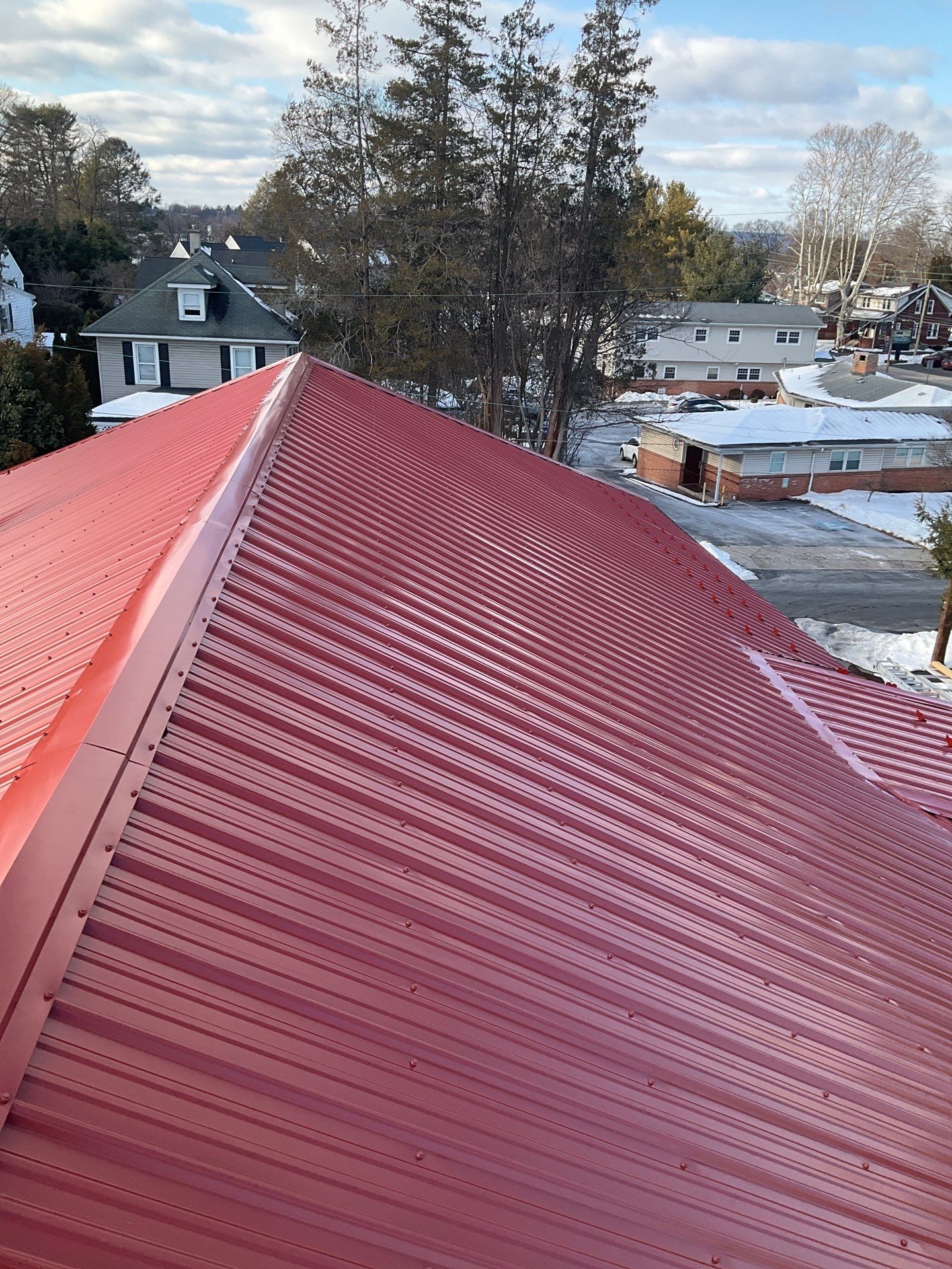 Red Metal Roofing Upgrade for Brick Home by Esh Builders