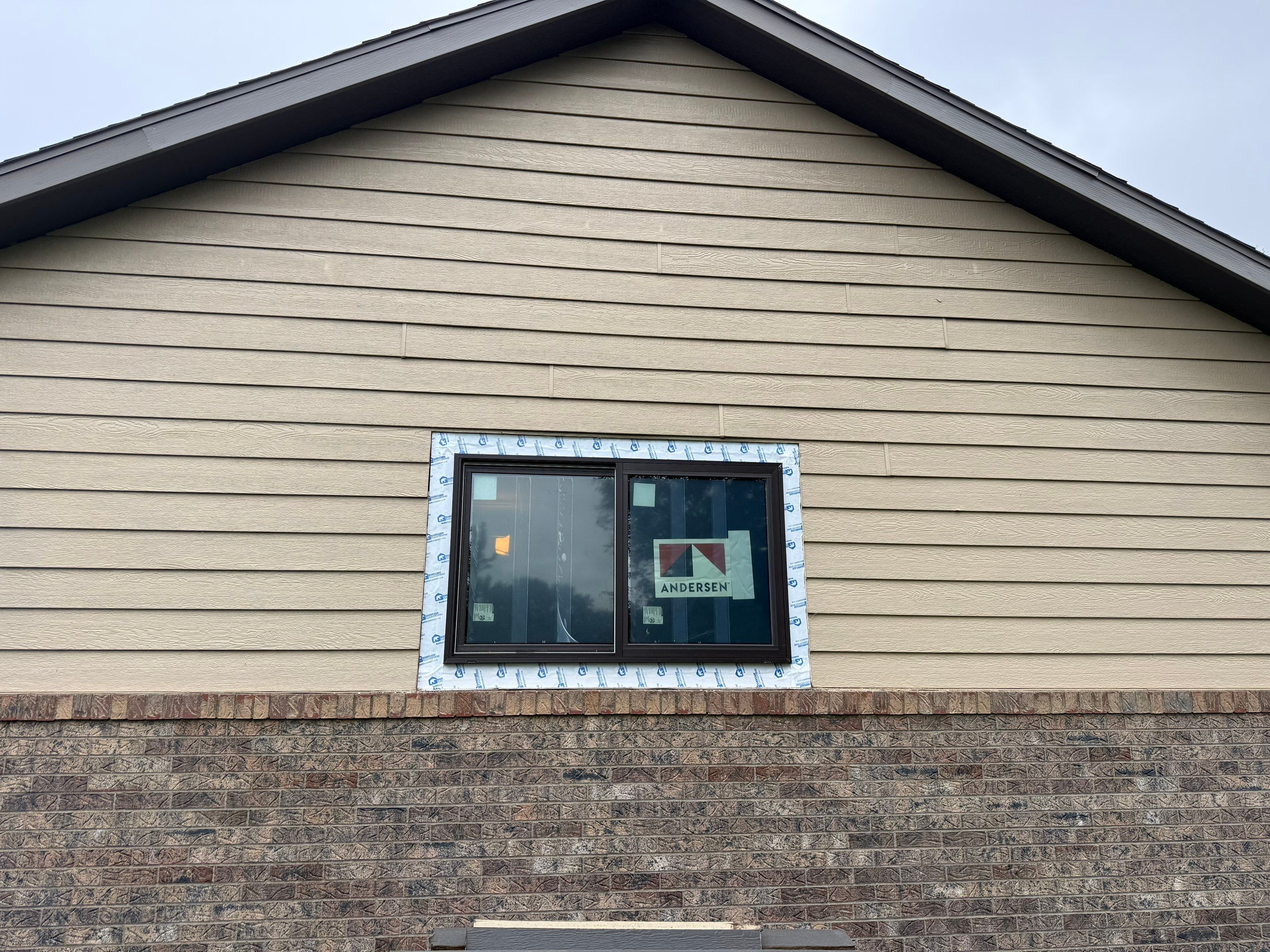 Yankton Garage Remodel with Andersen Window Installation and Drywall by Select Painting, Coatings & Garage Cabinets