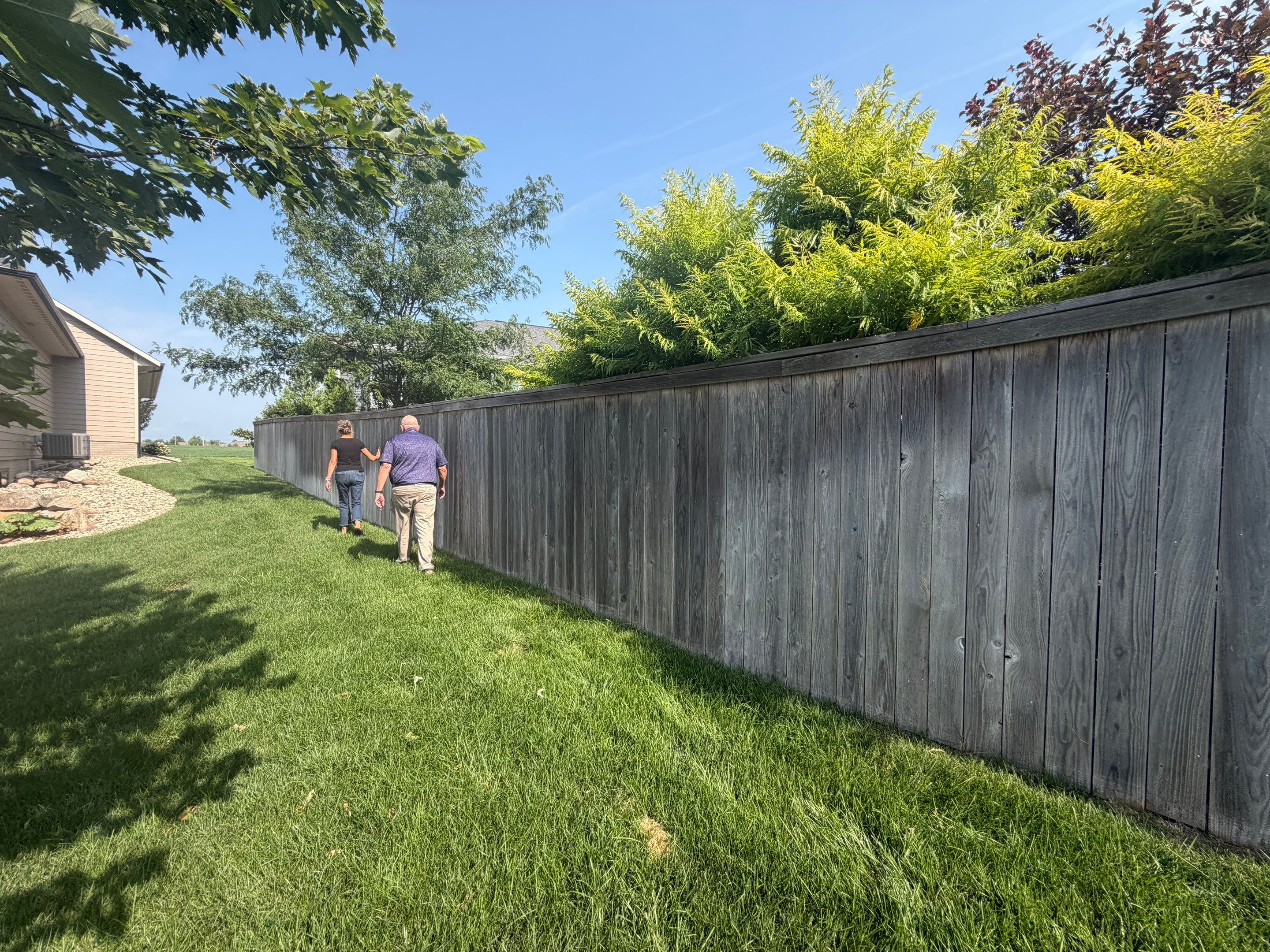 Custom Privacy Fence and Paver Patio Installation in Sioux Falls by Select Painting, Coatings & Garage Cabinets
