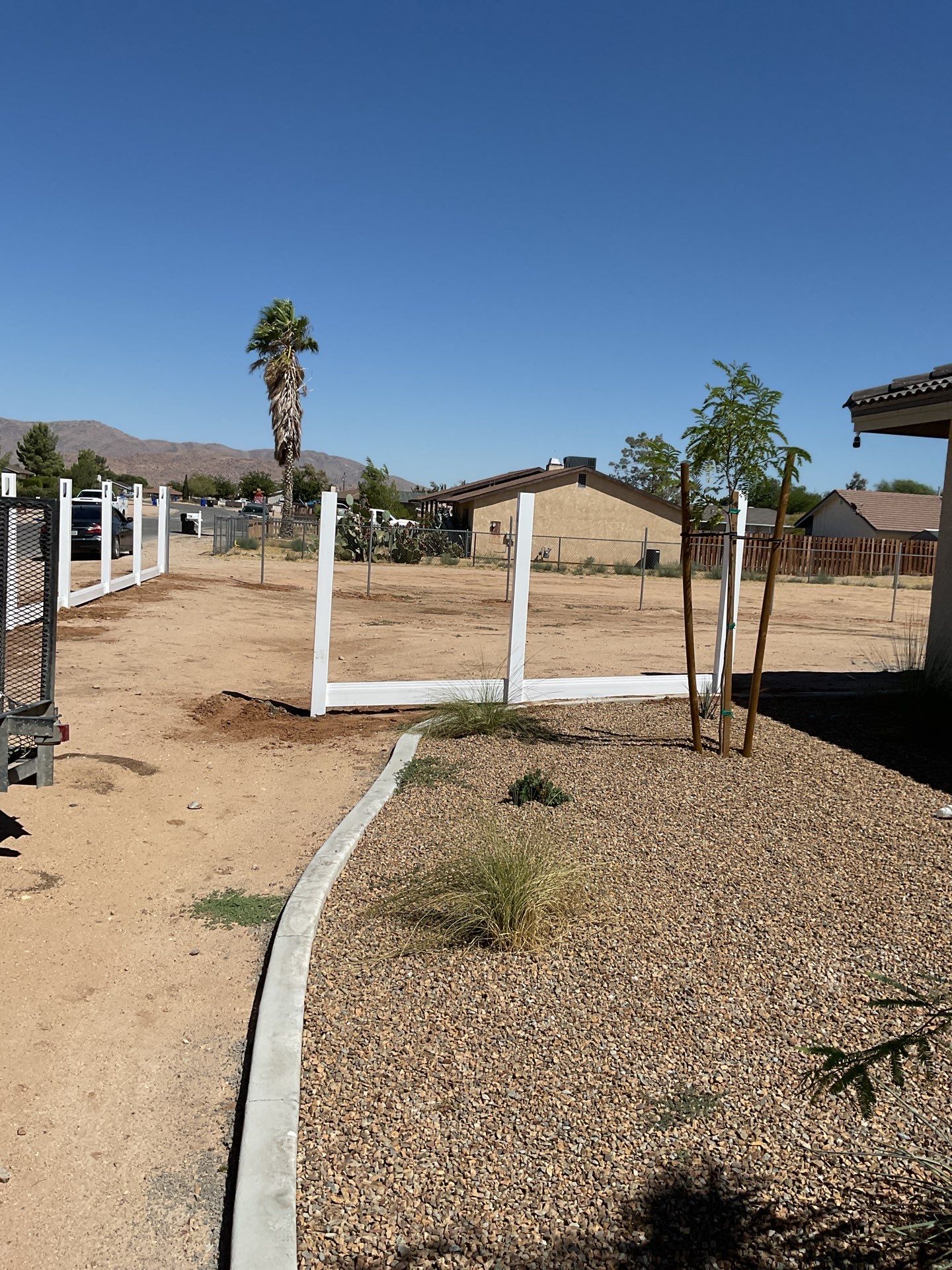 6ft White Privacy Vinyl Fence with Chain-link Fence by Fence Guys Inc.
