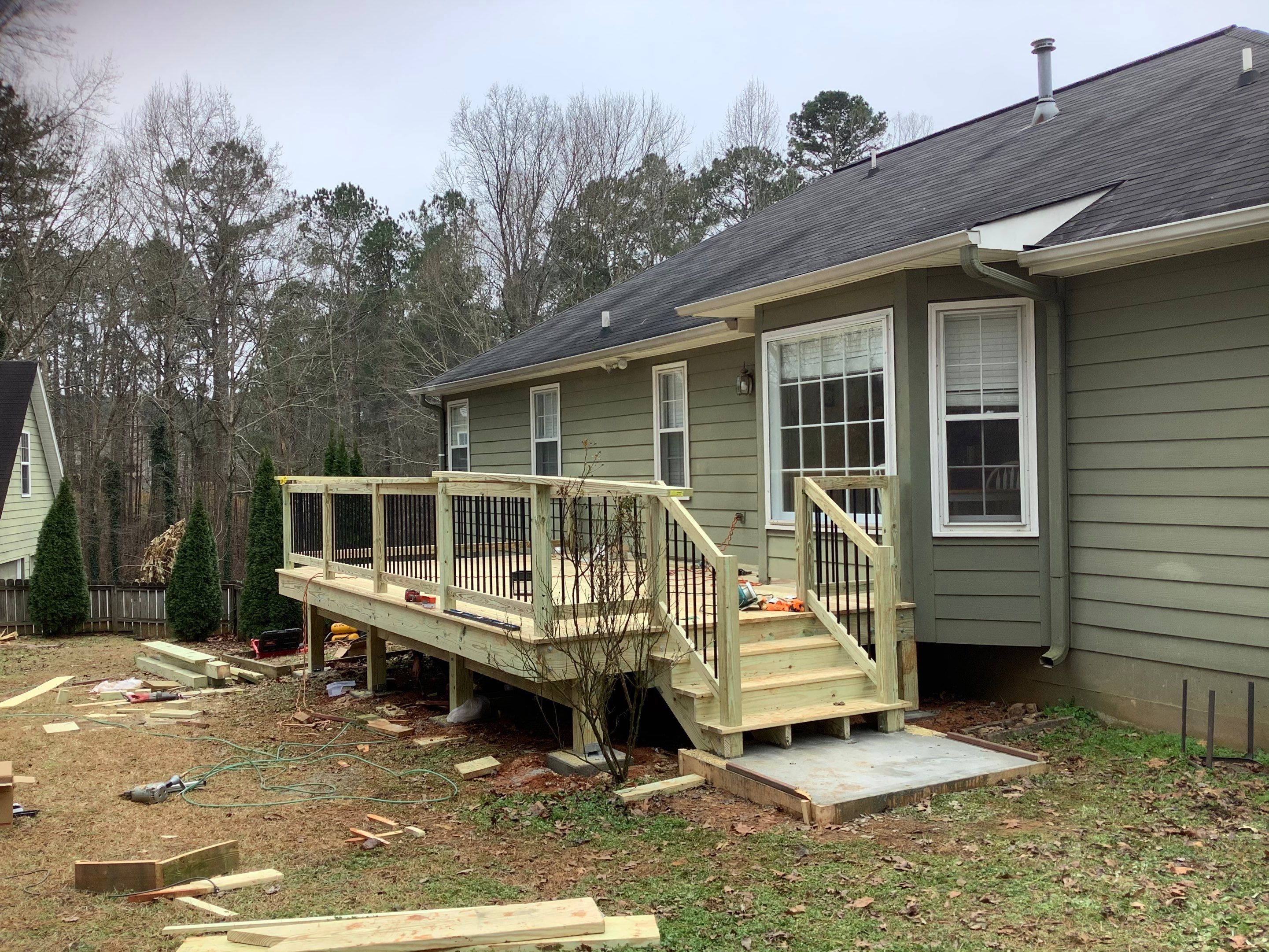 Raised Pressure-Treated Wood Deck Construction in Dallas, Georgia by Swift Home Renovations 