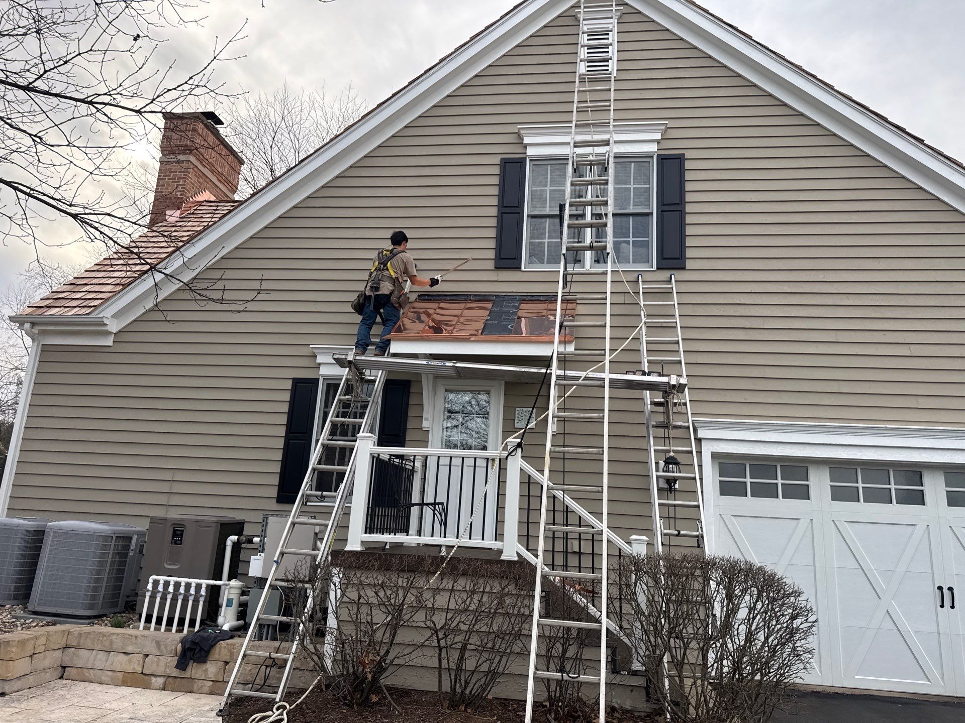 Re-roof: Cedar Shake & Custom Copper by Midwest Building Solutions