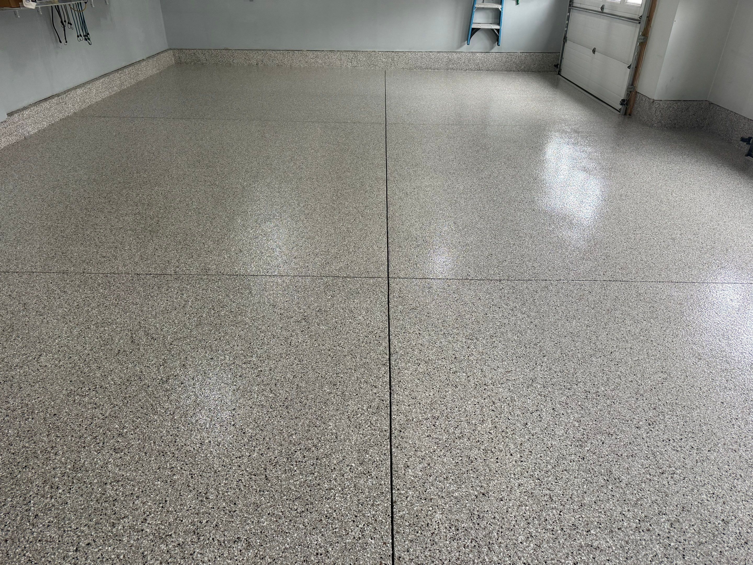 High-Gloss Epoxy Garage Floor Coating in Sioux Falls by Select Painting, Coatings & Garage Cabinets