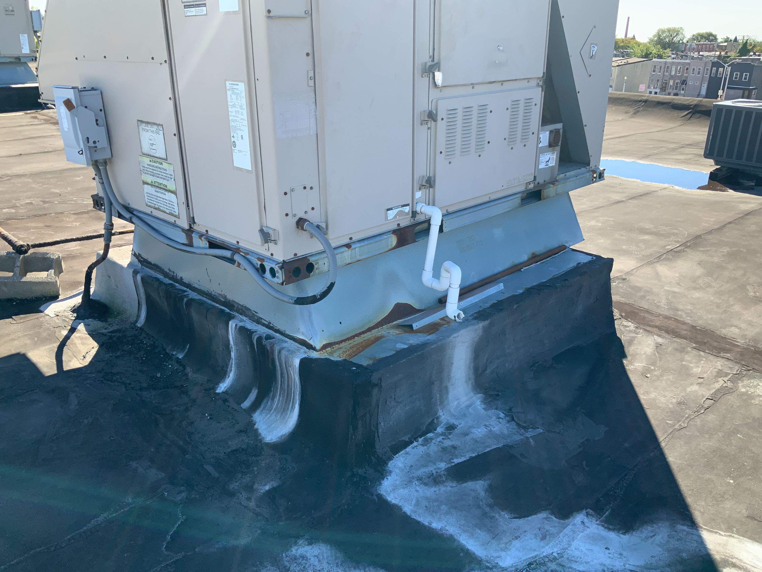 Commercial Roofing Repair using new Flashing by Alpha Design Services