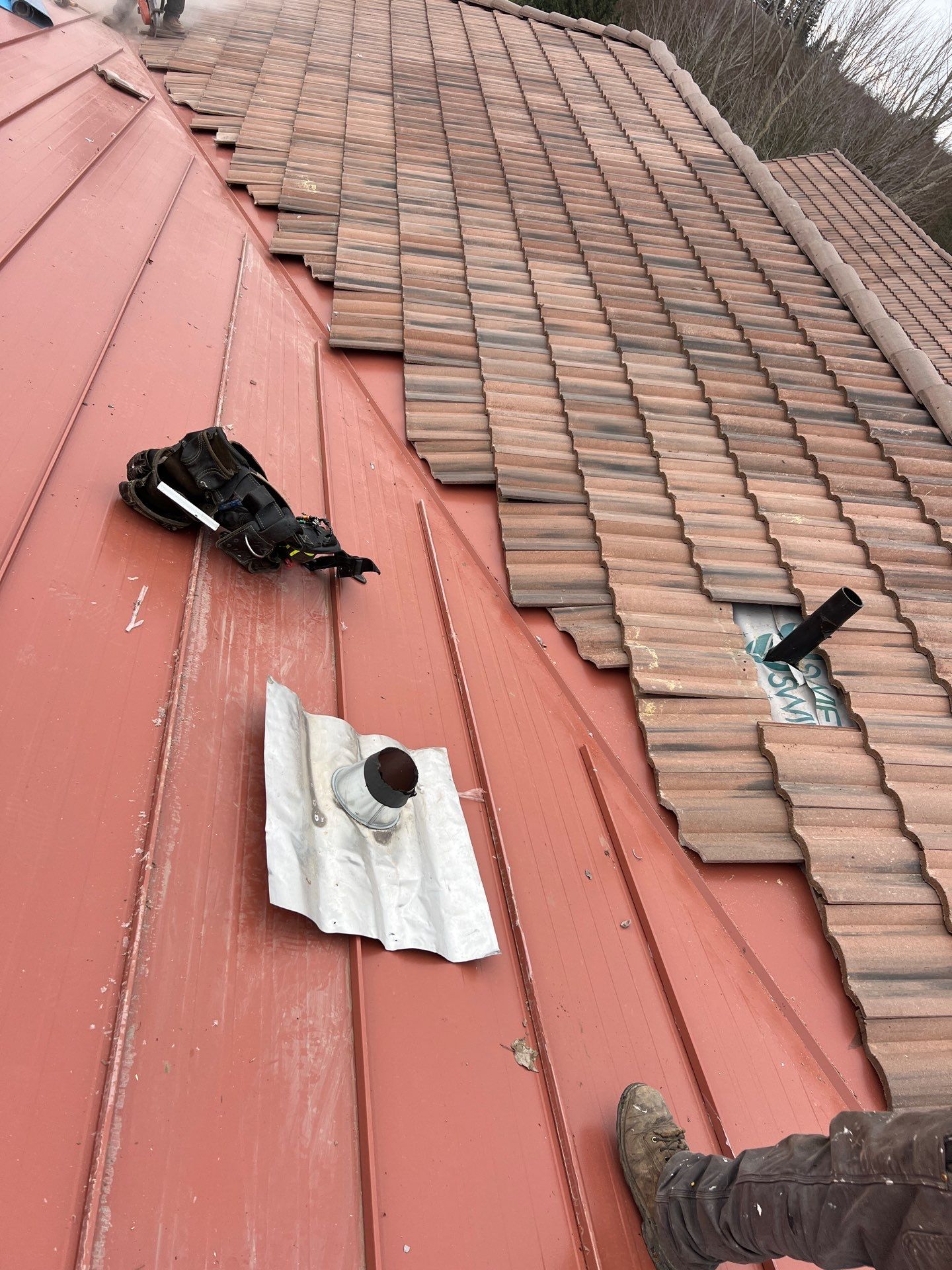Tile, Metal, and TPO roofing project (new construction) by Straight Edge Roofing Inc