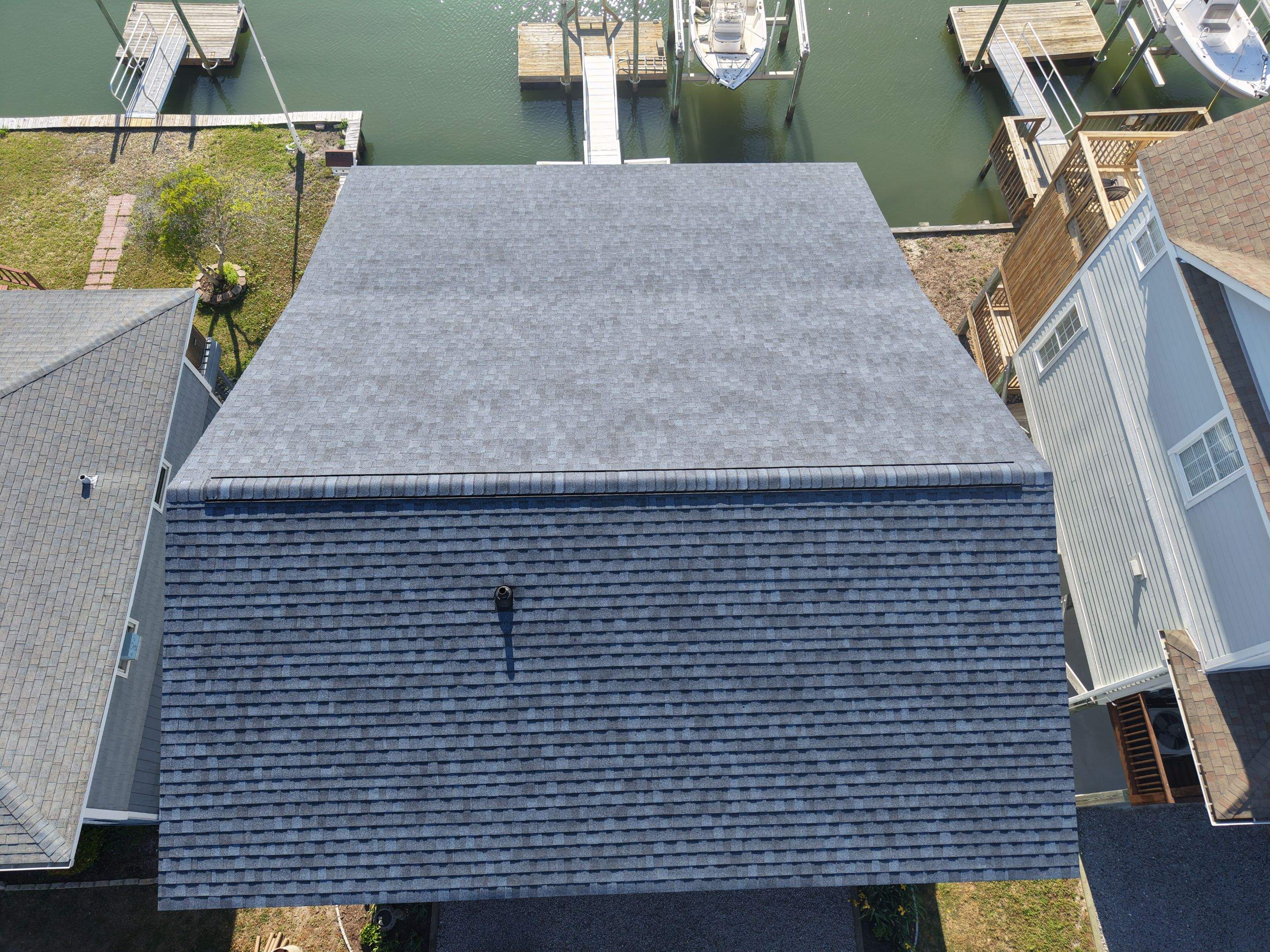 Holden Beach Canal-Side FORTIFIED Roof Replacement with Coastal Blue Shingles by RGR Construction and Roofing, LLC