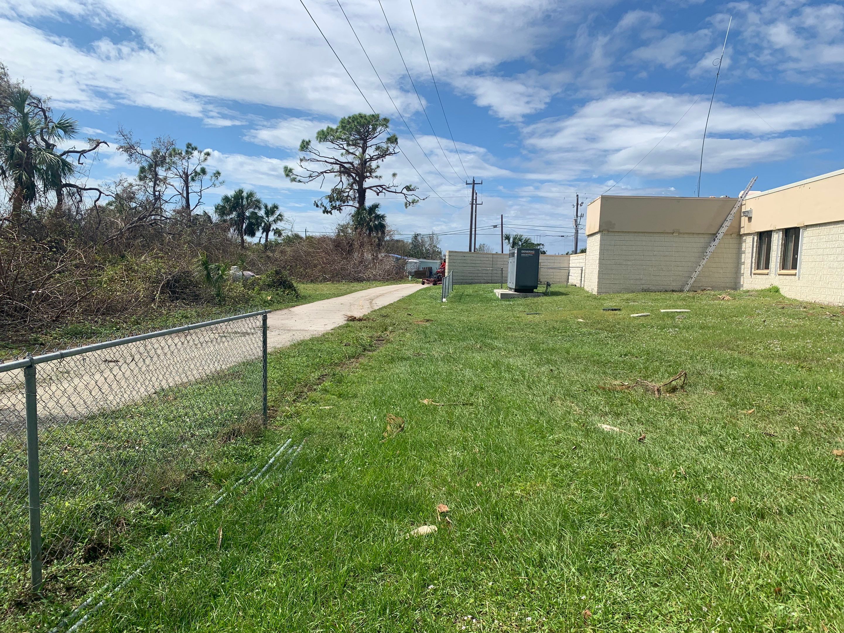 Commercial Chainlink and Vinyl Fence With Aluminum Framed Gates On Dumpster Enclosure by Asap fence and gates, LLC