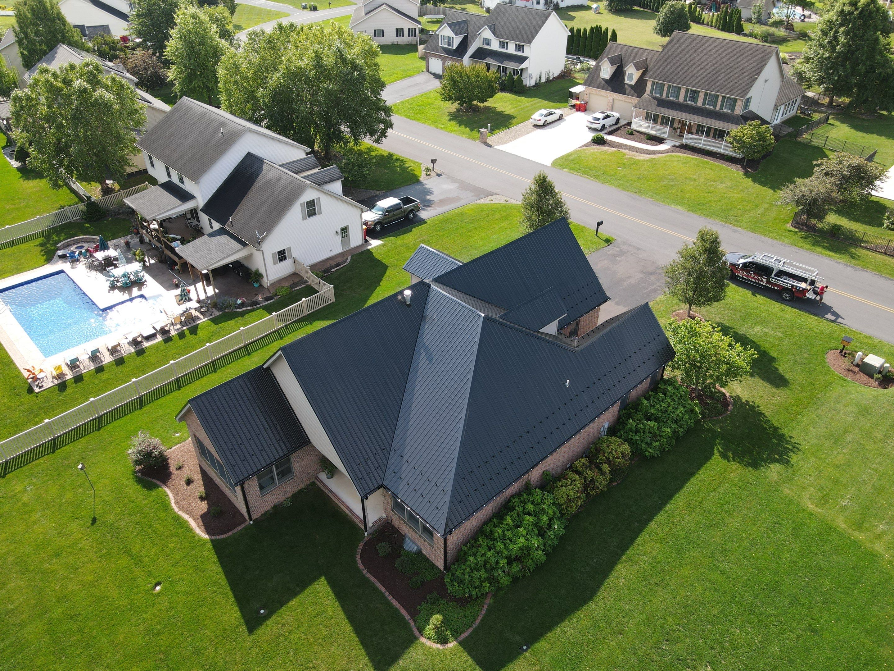 Standing seam / Azm panel in black  by Teflon Roofing