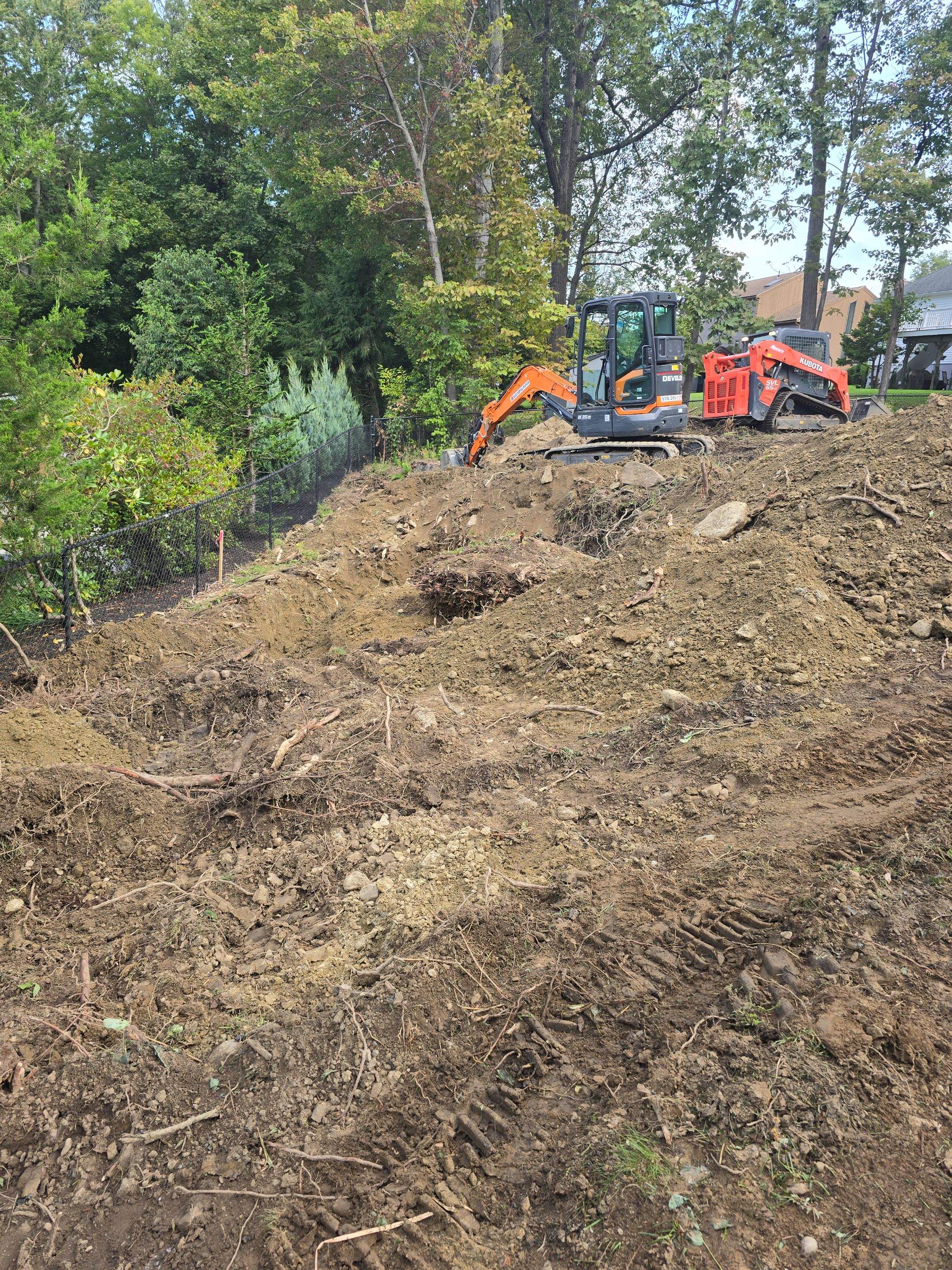 Retaining Wall to Level Backyard  by May Property Management 