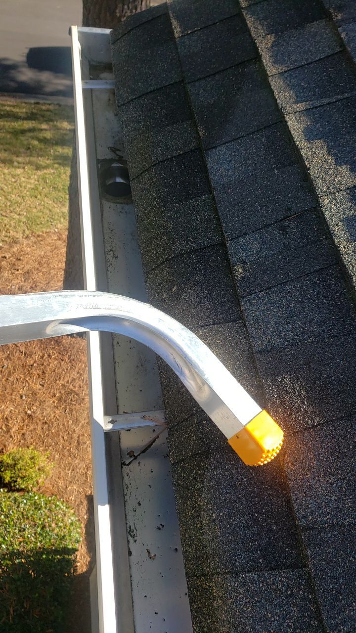 Sara Gutter cleanout using water by Power Wash Masters LLC