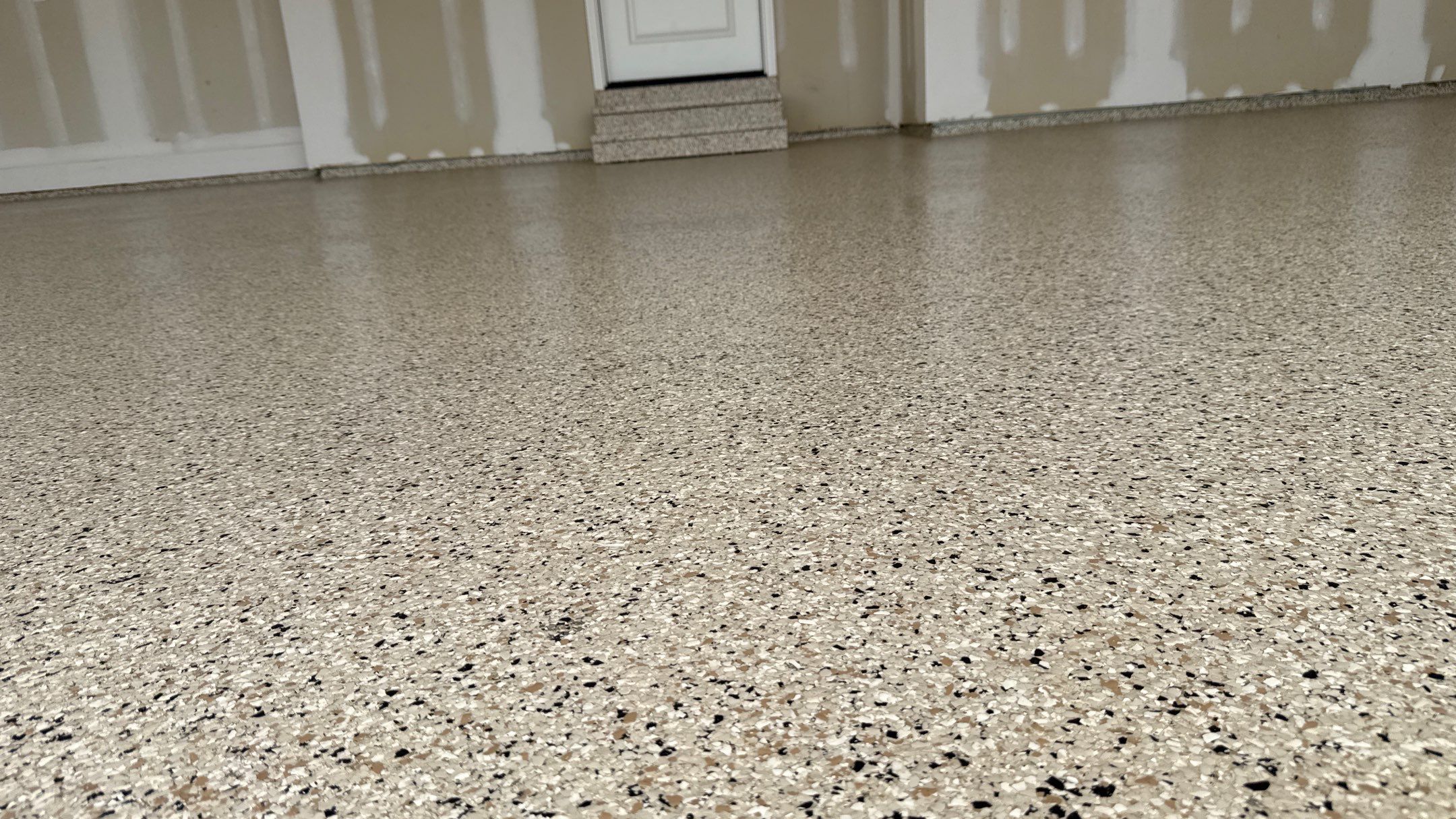 Raymore Garage Finishing With Custom Epoxy Floor Coating by Banner Garage