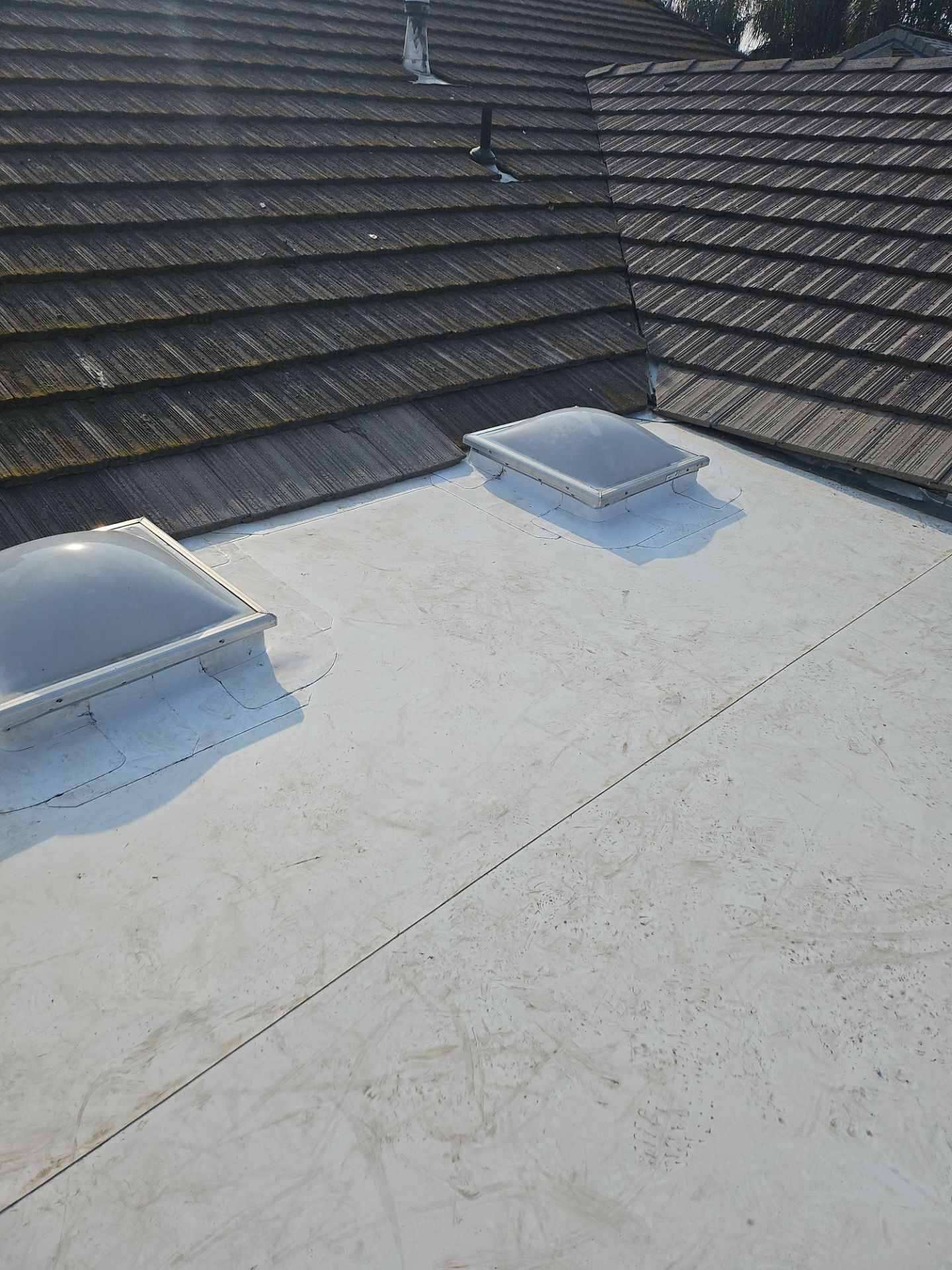 Single-ply roofing system on porch using TPO 60 mil by Straight Edge Roofing Inc