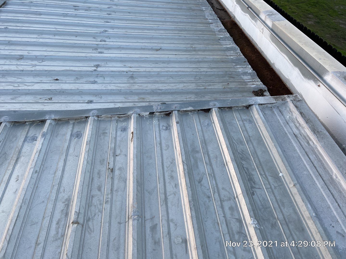 Metal roof restoration on commercial roof using Conklin Benchmark/ PUMA XL acrylic coatings over metal and foam by Straight Edge Roofing Inc