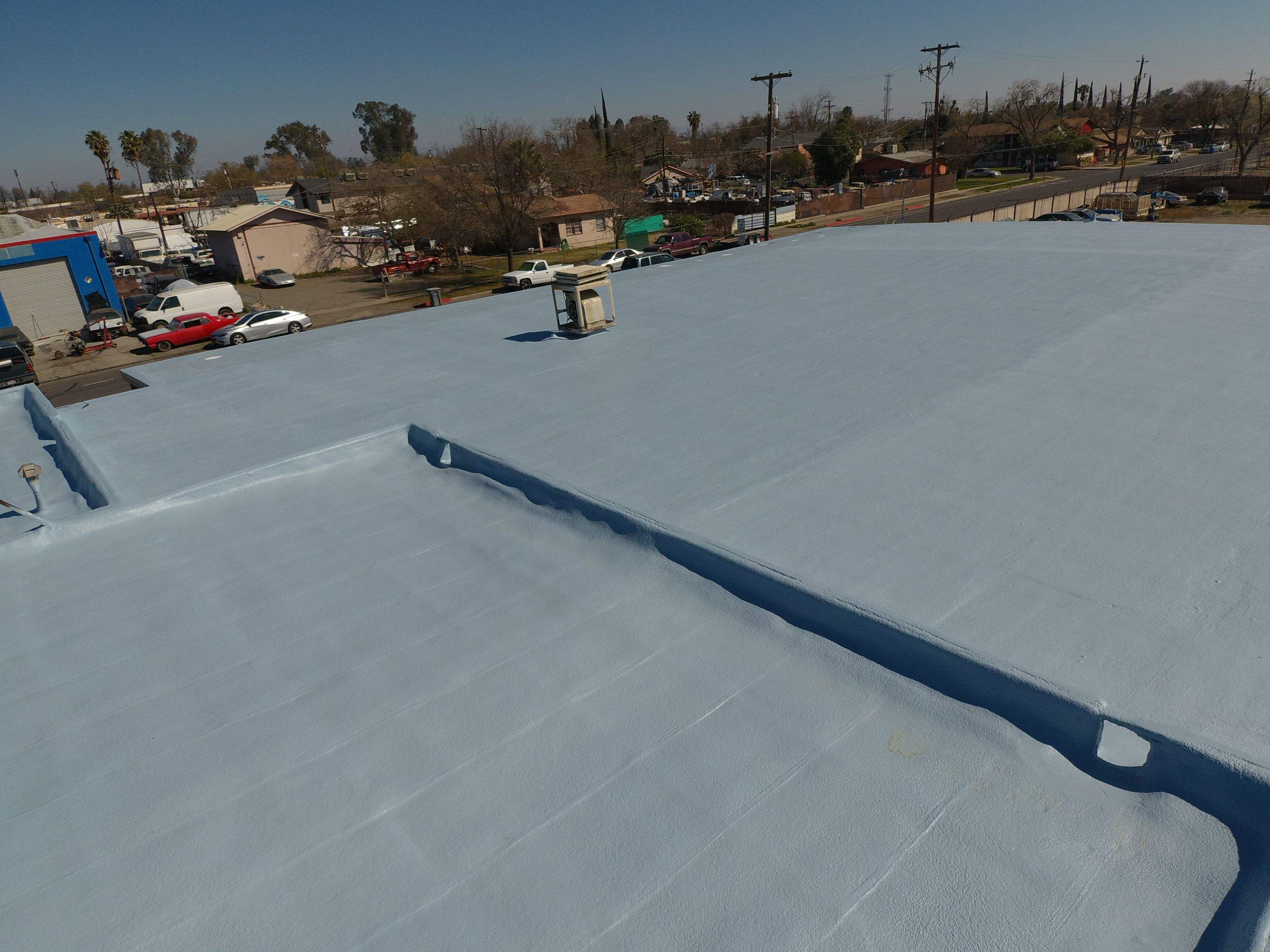 Spray foam and coatings using Conklin Benchmark/PUMA XL coatings and spray foam by Straight Edge Roofing Inc