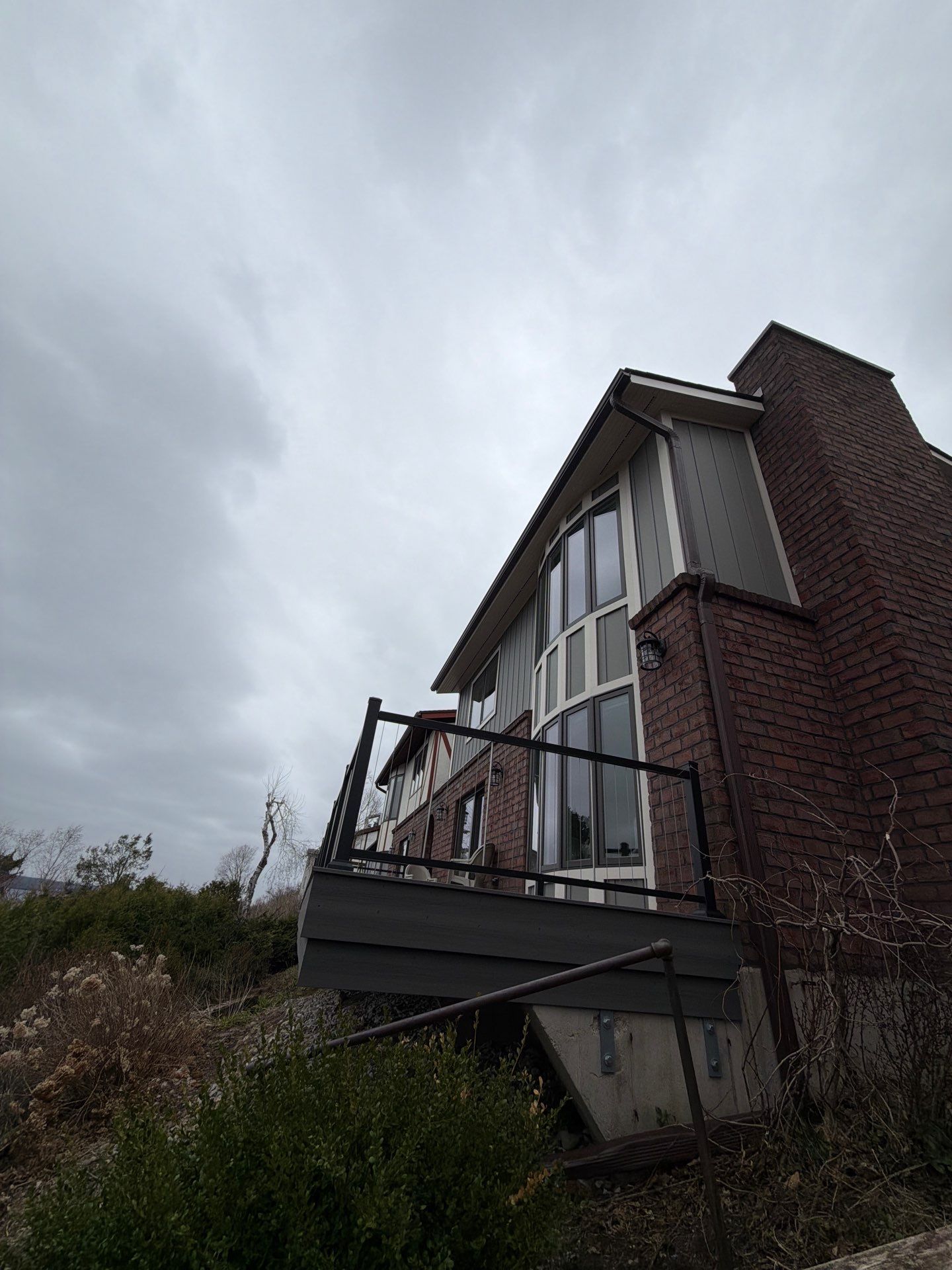 Gutter and Downspout Installation for Petoskey Residential Brick Exterior by Rainbow Seamless Systems