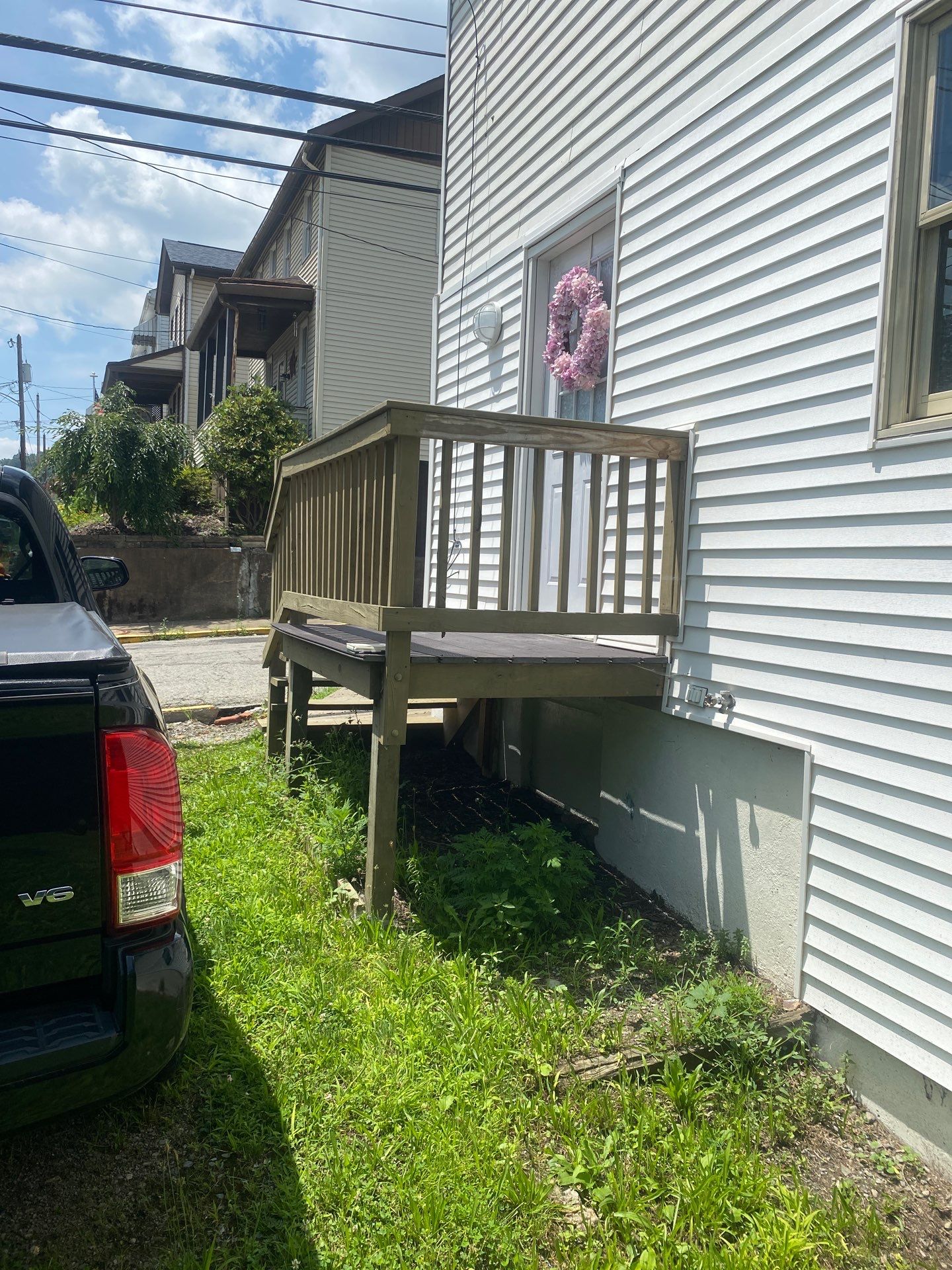 White siding  by Cousins Roofing Siding & Decks