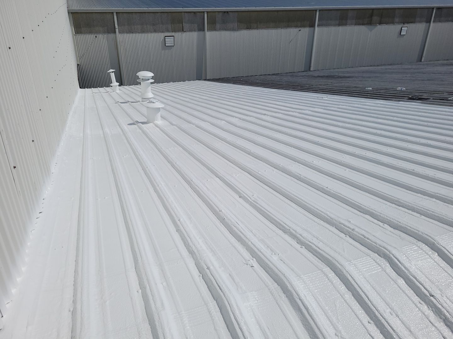 Commercial Metal Restoration System using Aldocoat Coatings by Hostetler Roofing