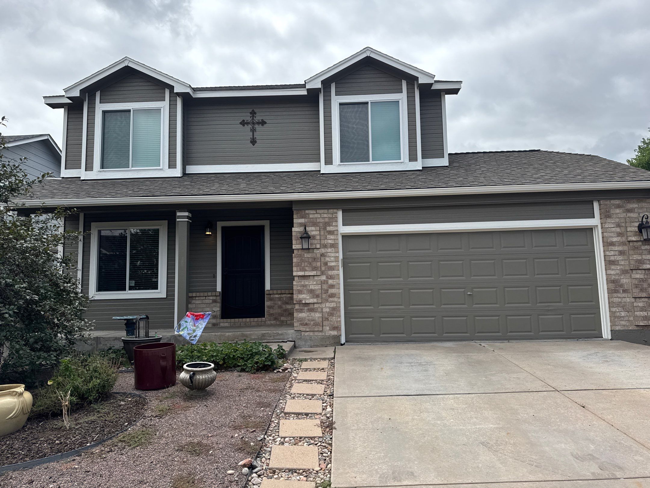 Exterior siding and trim paint on significantly sun damaged home in Cimarron Hills by Carroll Painting LLC