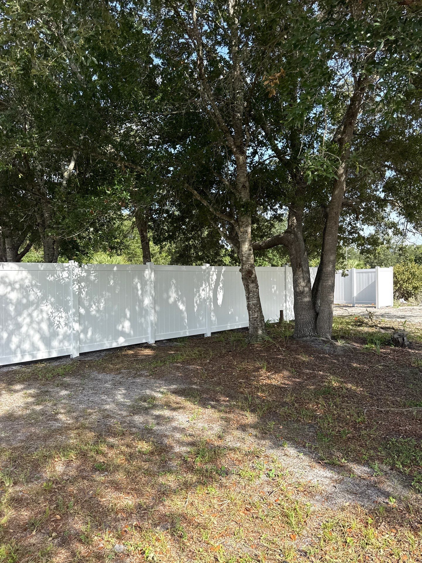 White Vinyl Privacy Fence Installation and Gate Assembly in Punta Gorda by True Fence LLC