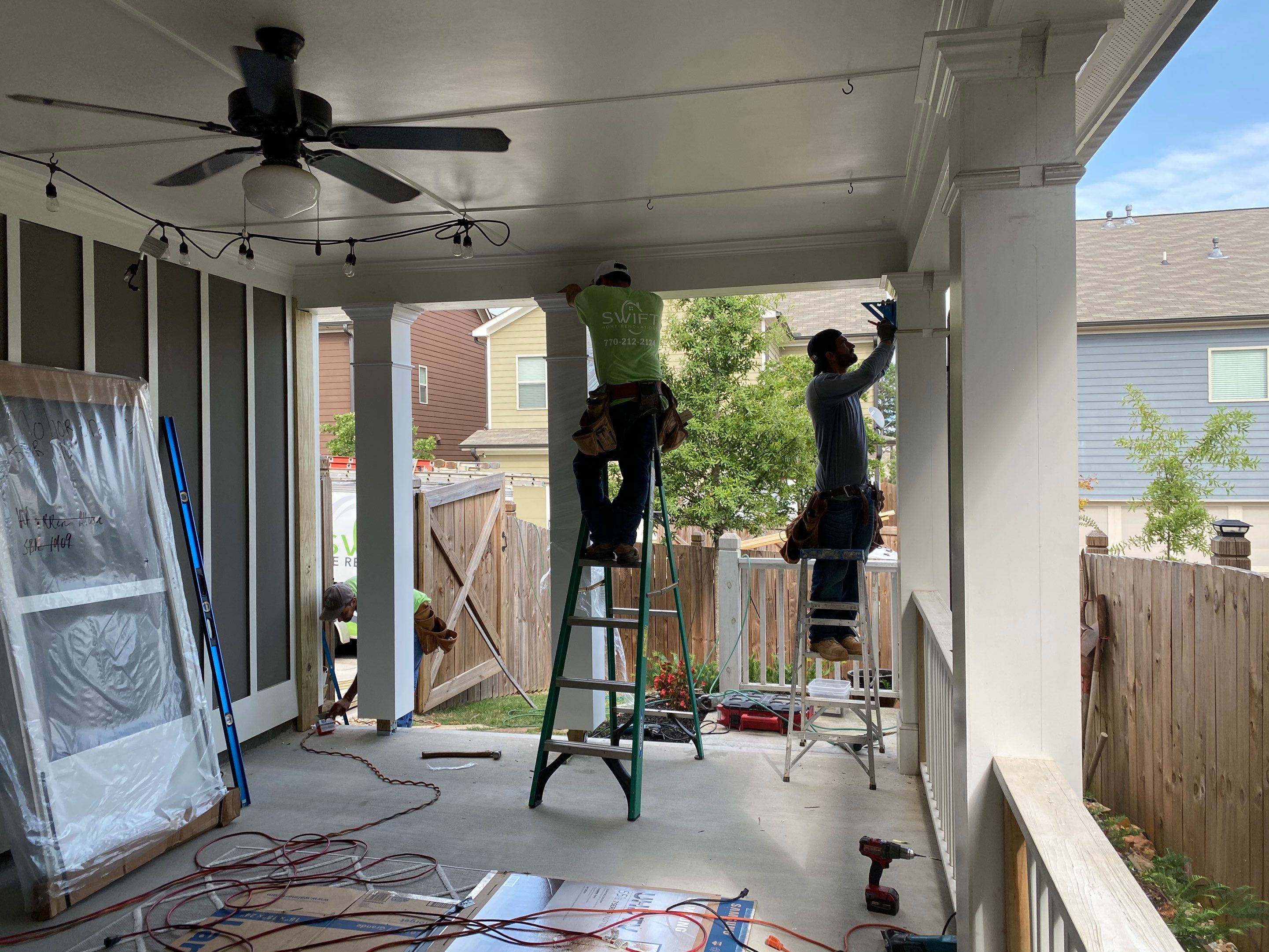 Custom Screened-In Porch Enclosure with White Railings in Smyrna by Swift Home Renovations