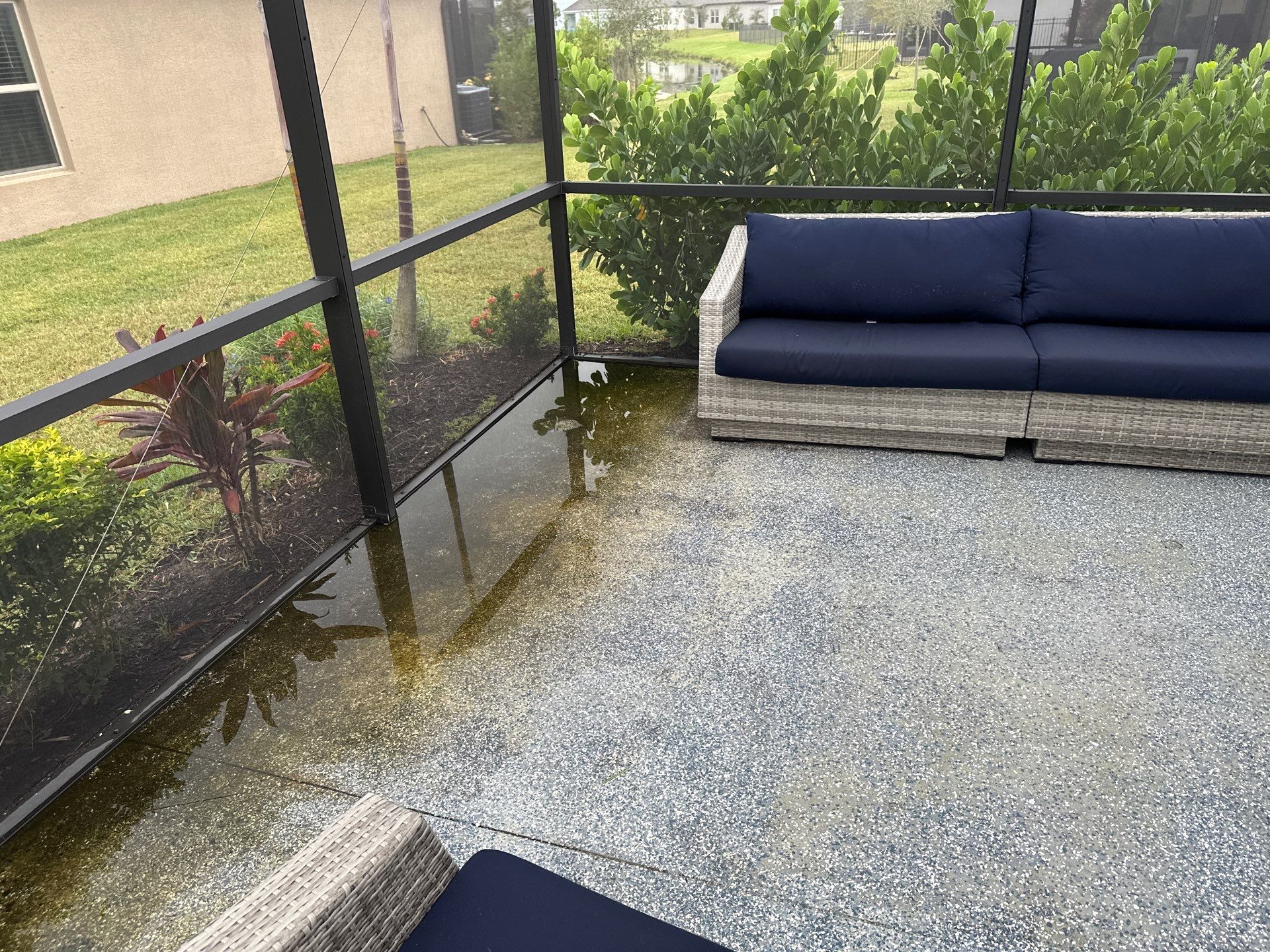 Lanai & Patio Cleaning with Epoxy-Coated Concrete Floor in Trevesta Community, Palmetto, FL | Sunshine AquaWash by Sunshine AquaWash