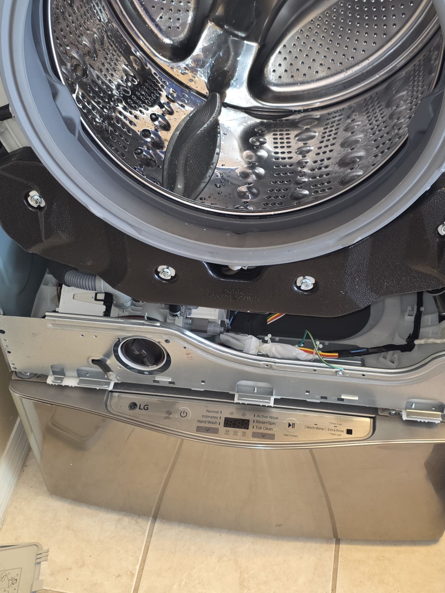 LG Front-Loading Washing Machine Repair and Pump Replacement in Windermere by AMB-WORKS APPLIANCE REPAIR