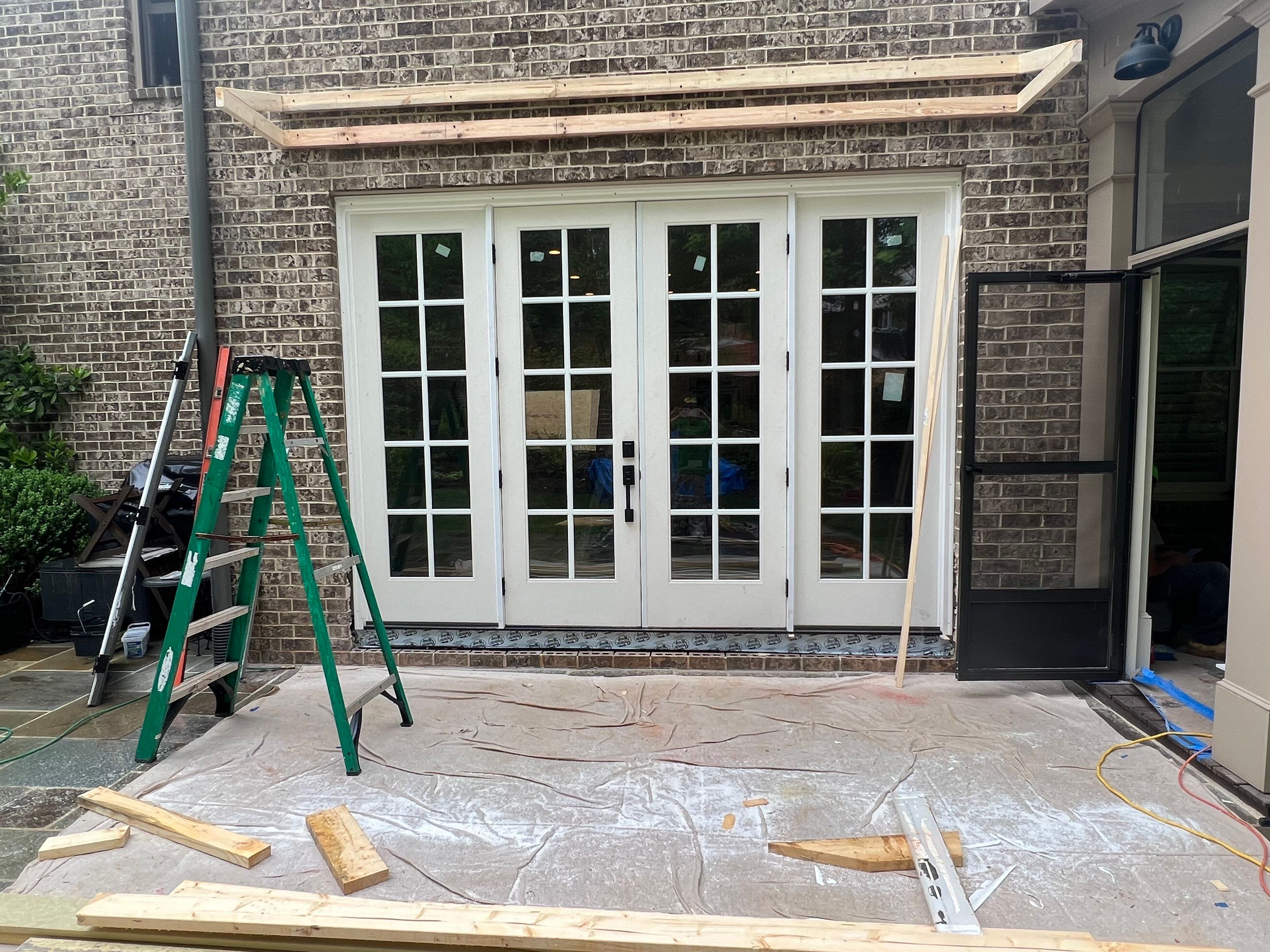 Atlanta French Door Installation with Custom Wood Overhang and Flagstone Patio by Swift Home Renovations