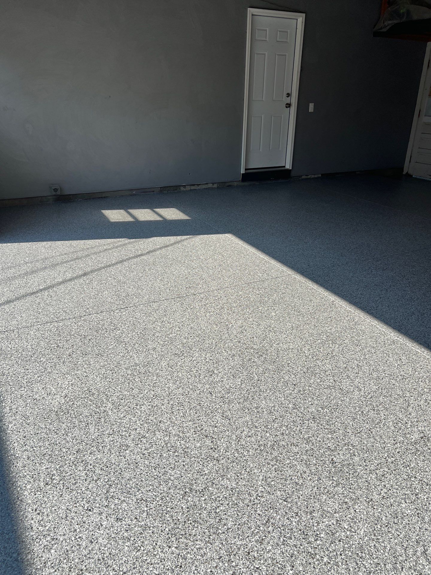 Concrete garage floor replacement and epoxy coating installed by NG Masonry & Construction LLC