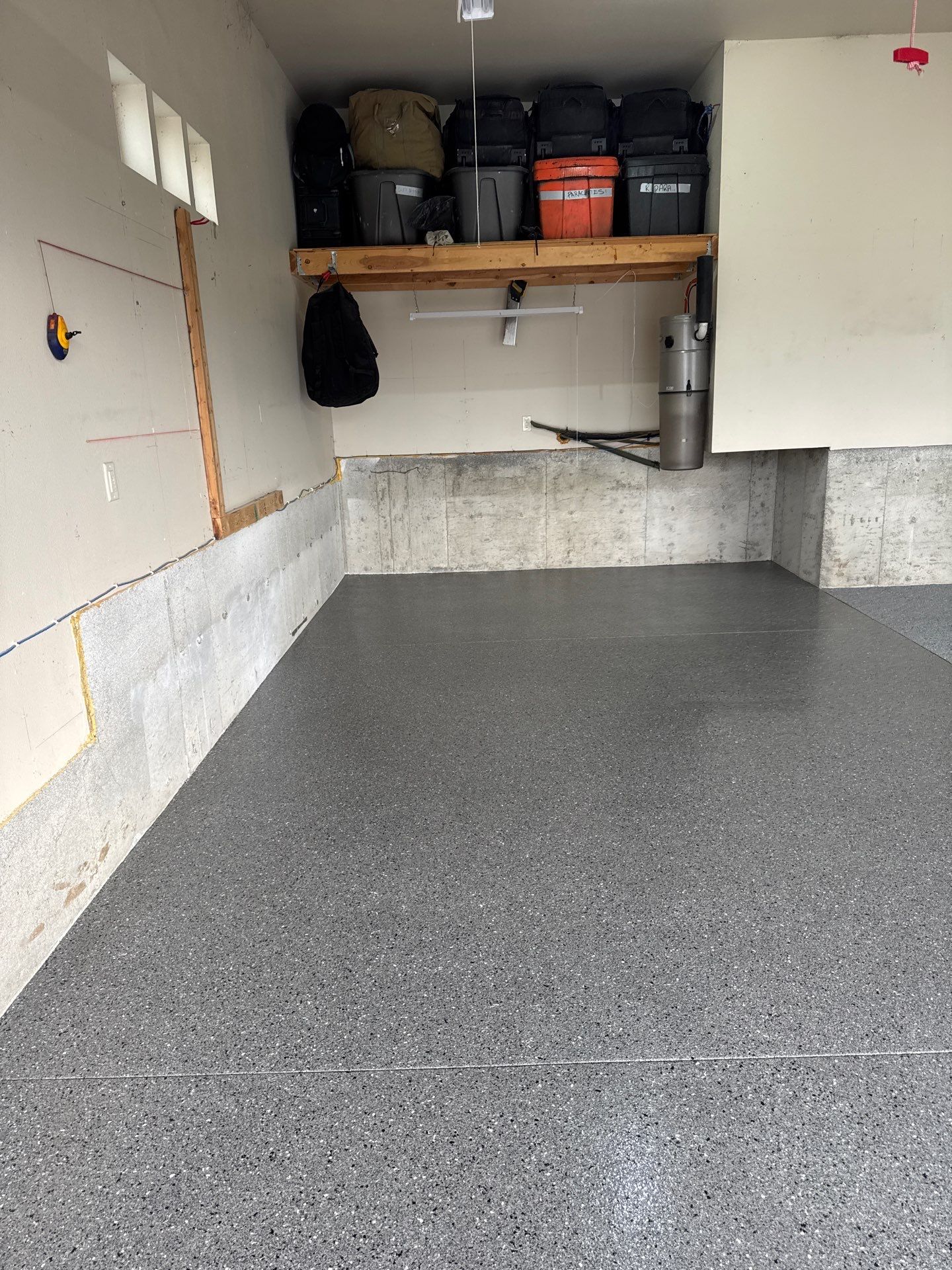 Custom Gray Speckled Polyaspartic Garage Floor Coating in Cheney by Croc Coatings, LLC