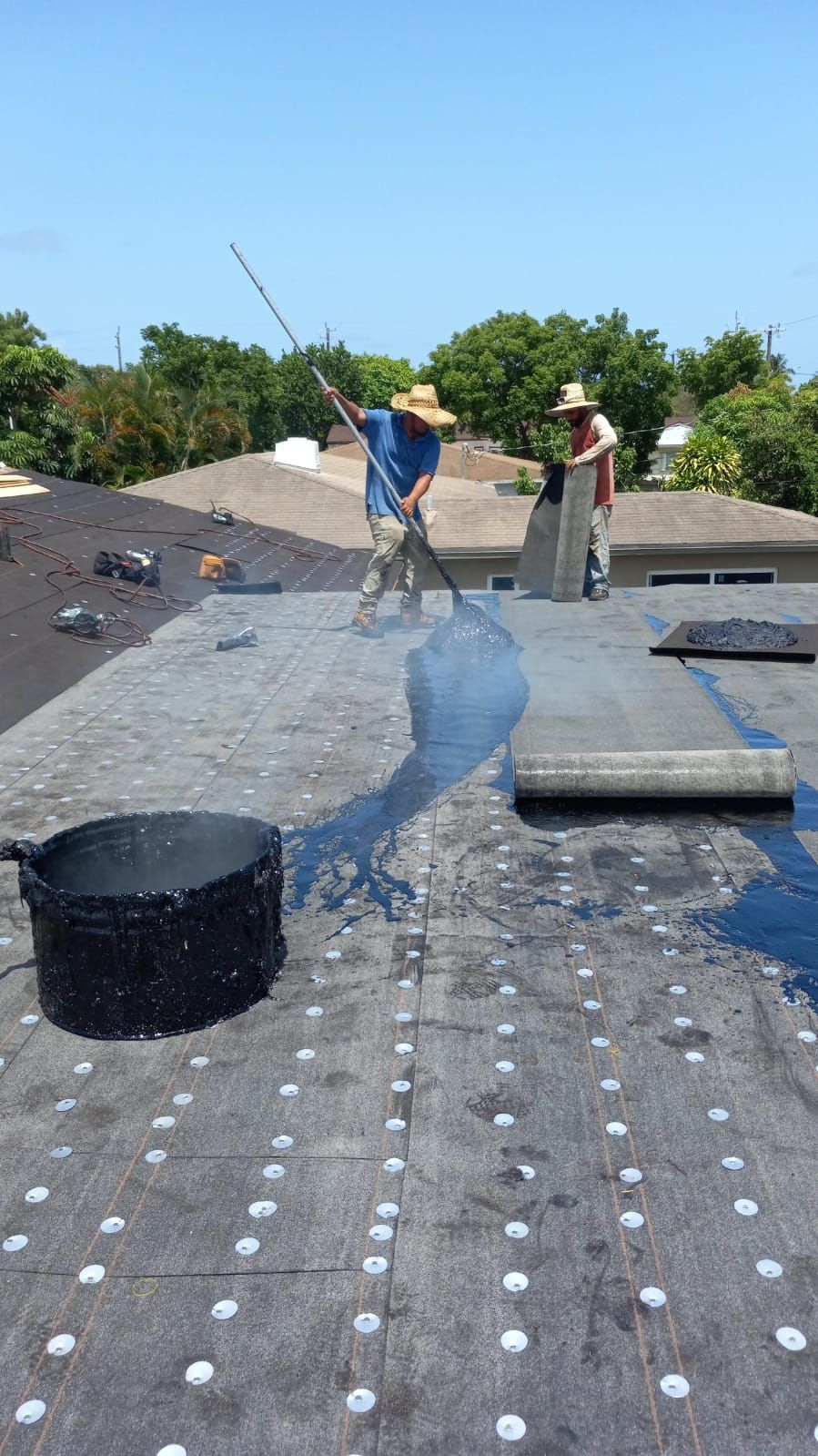 Standing Seam Metal & Flat Re-Roof using 1.5" Nail Strip 24ga Black Matte Kynar Coated Standing Seam Metal Panels by Morton Roofing, Inc.