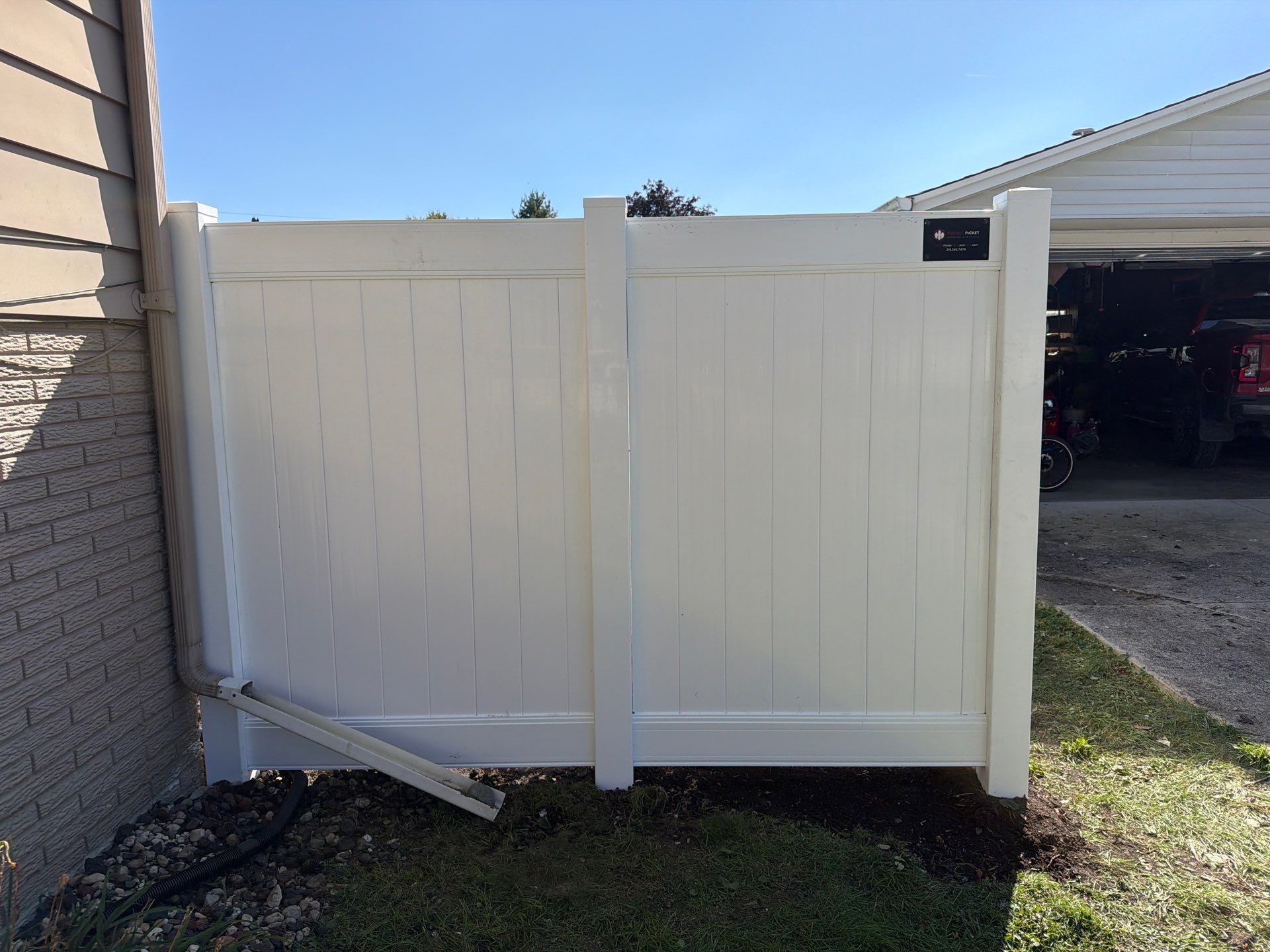 Custom Vinyl Privacy and Black Chain Link Fence Installation in Cedar Falls by Perfect Picket Fence and Stain