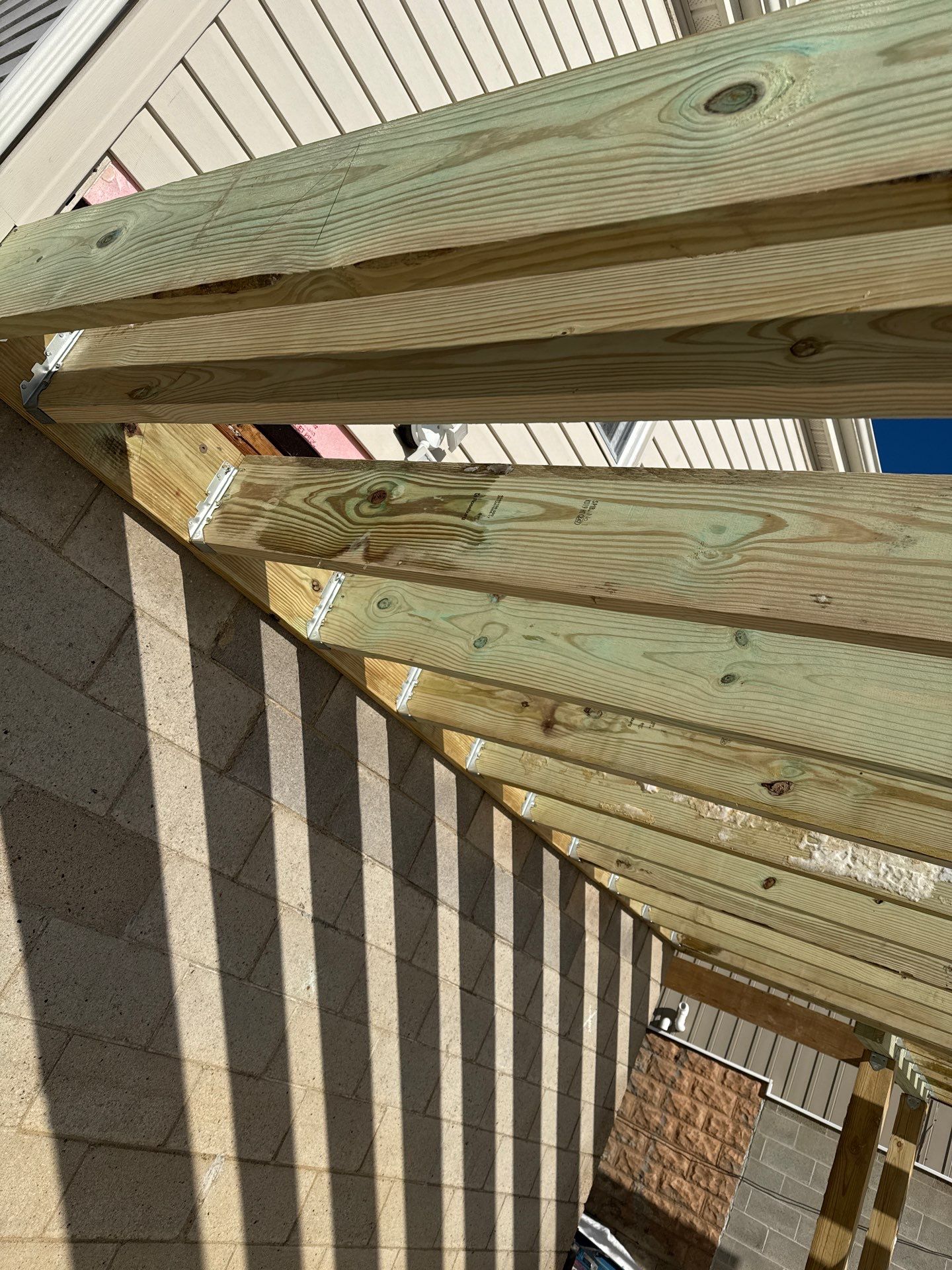 Deck and door by Cousins Roofing Siding & Decks