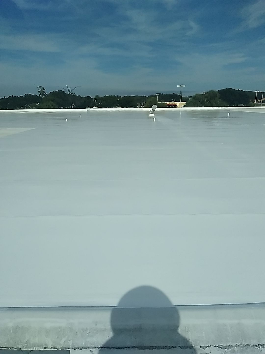 Silicone Roof Coating and Parapet Wall Repairs in South Bradenton by CES Roofing