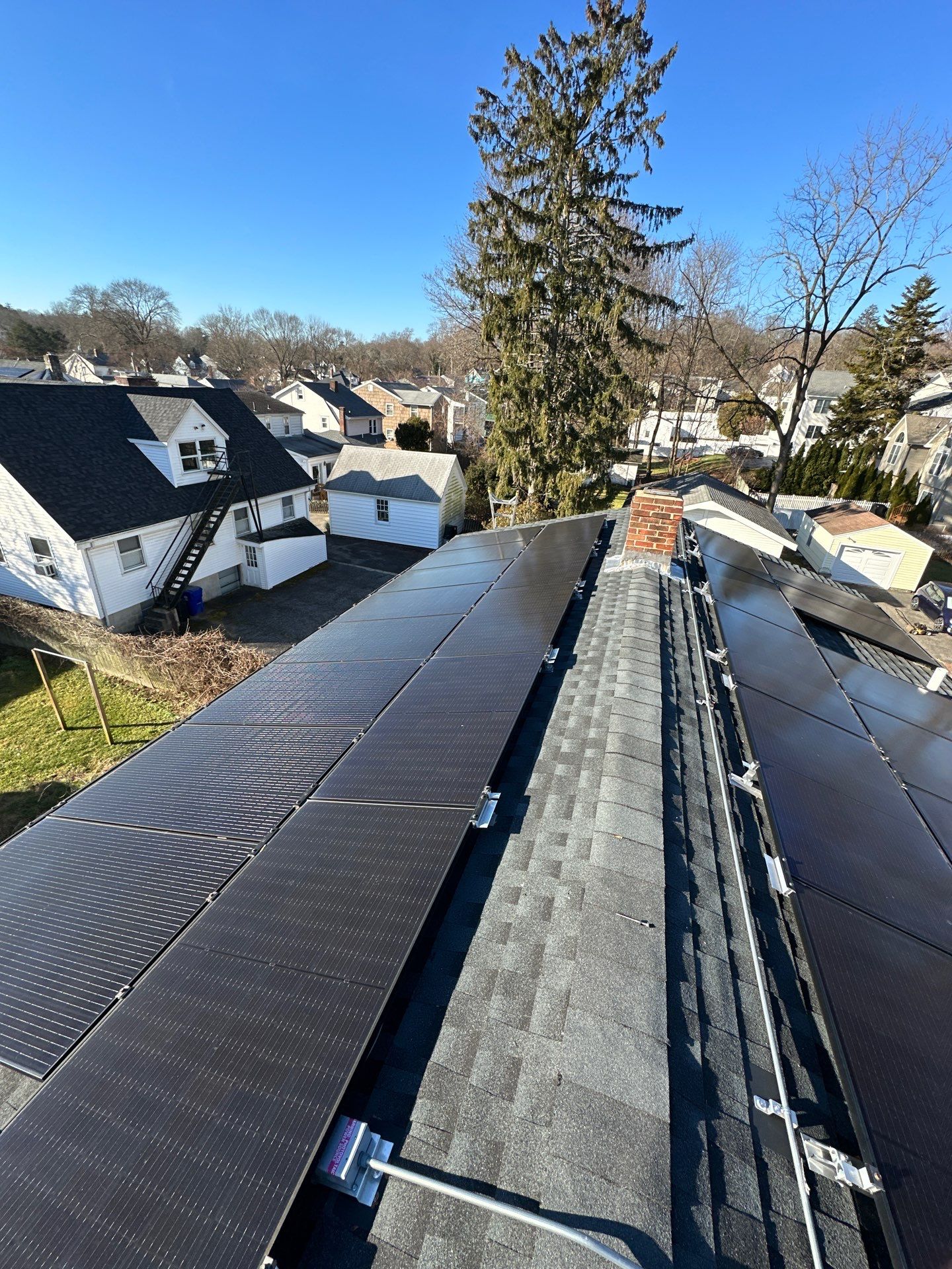 Charcoal Shingles by Reimagine Roofing