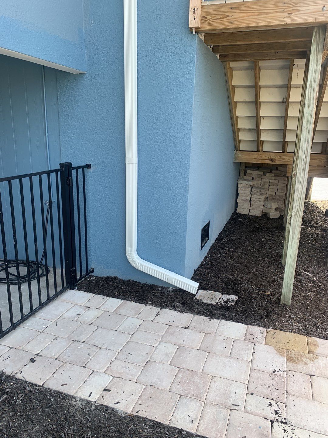 Downspout Installation for Two-Story Home in Fort Myers FL by Gutter Professor by Gutter Professors