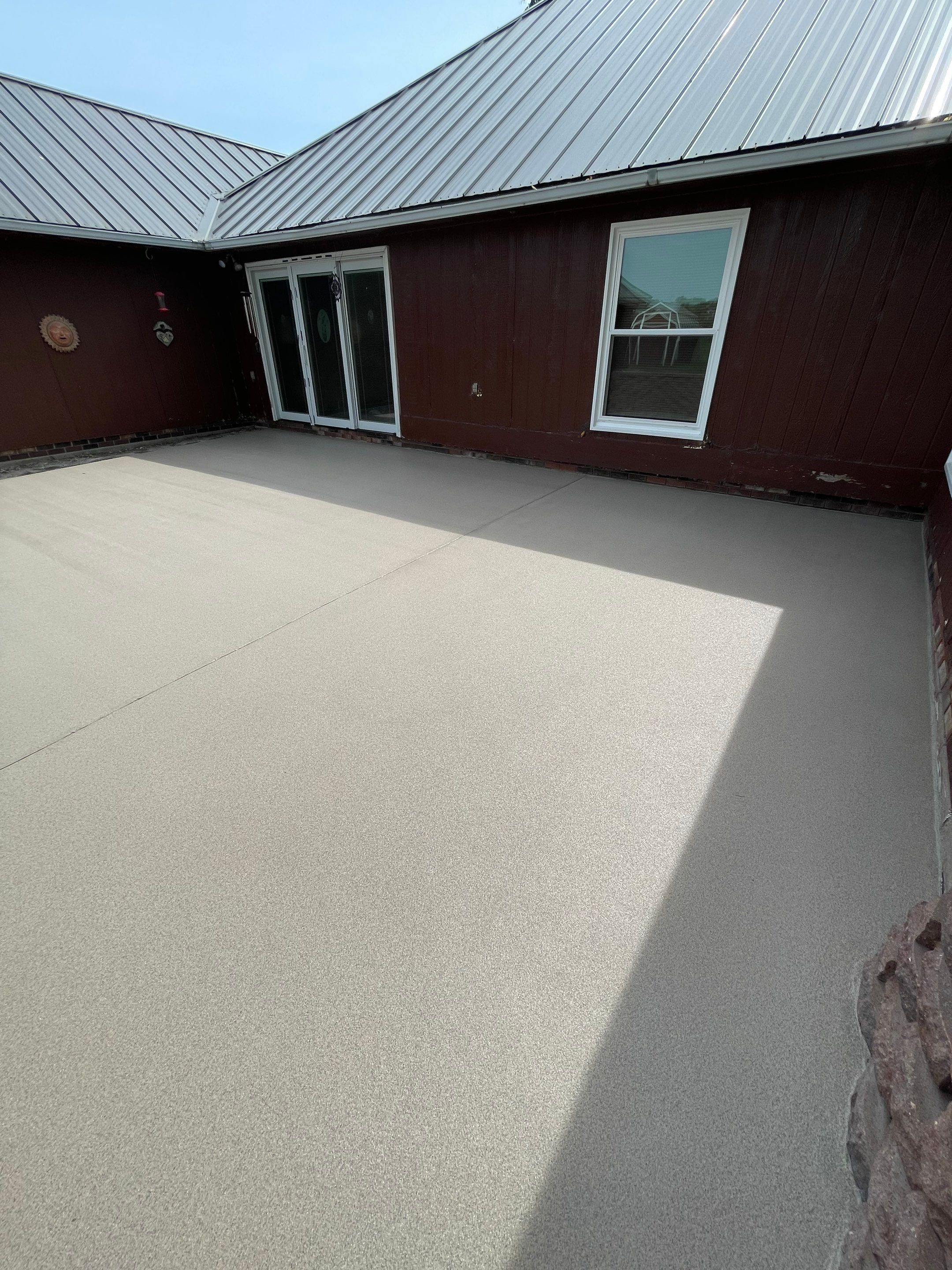 Concrete Patio Resurfacing and Protective Coating in Winfred, South Dakota by Select Painting, Coatings & Garage Cabinets