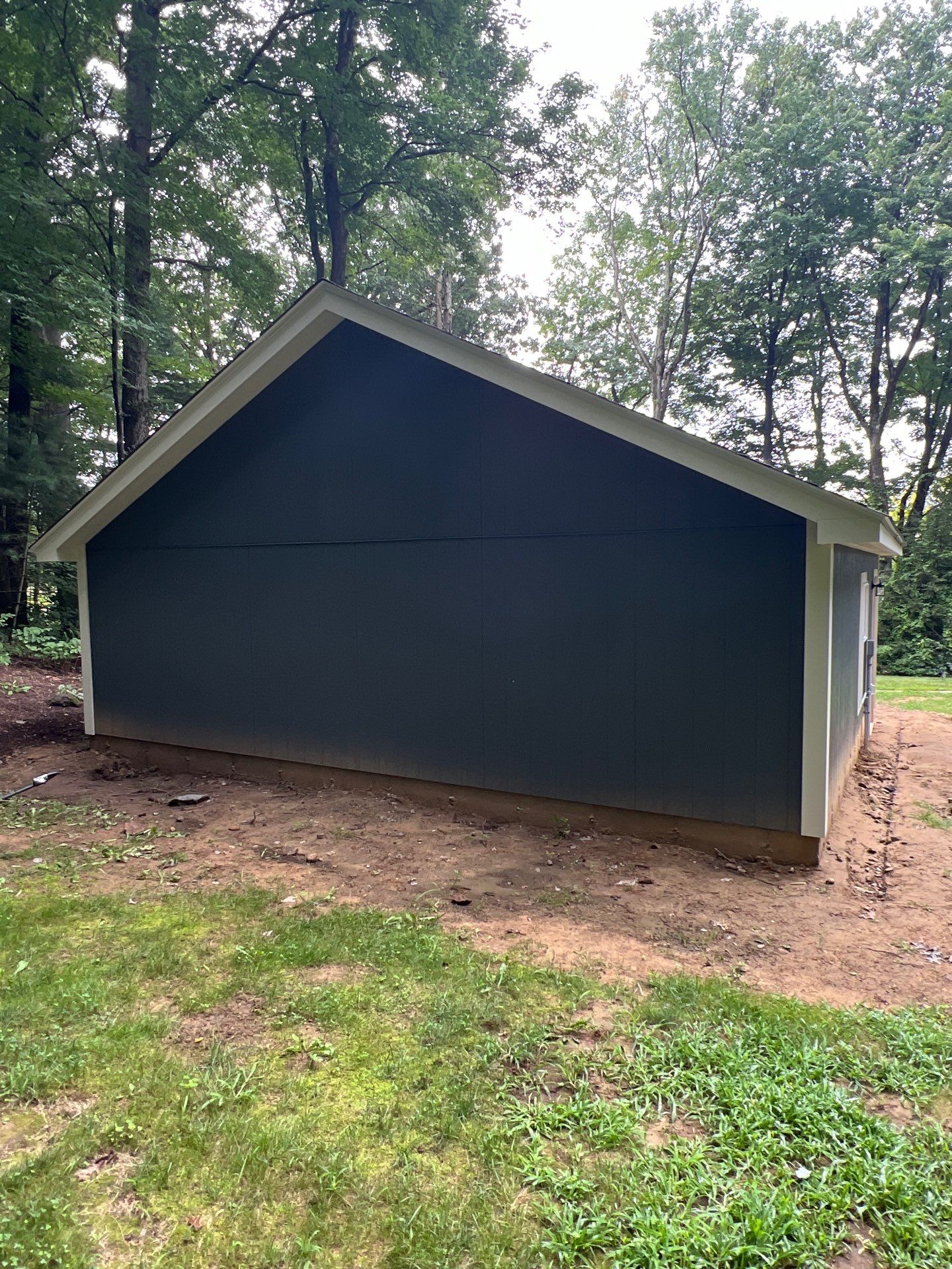 Garage using LP SmartSide Panel Siding by Chagnon Building & Remodeling LLC