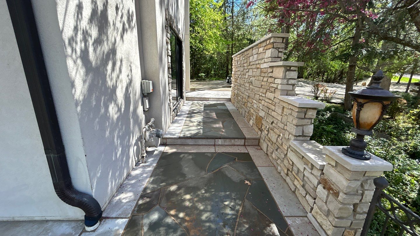 natural stone using Algaecide, soft wash soap by Northern Power Washing LLC.