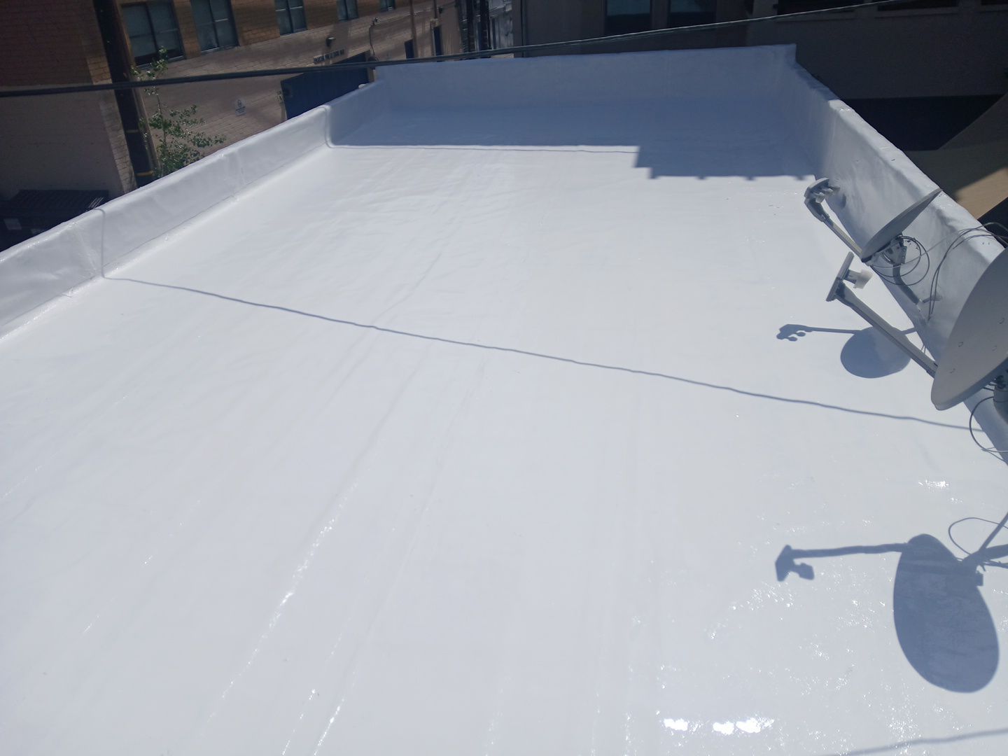 Apartment Building 2nd Layer Installation &Silicone coating by Hull Brothers Roofing