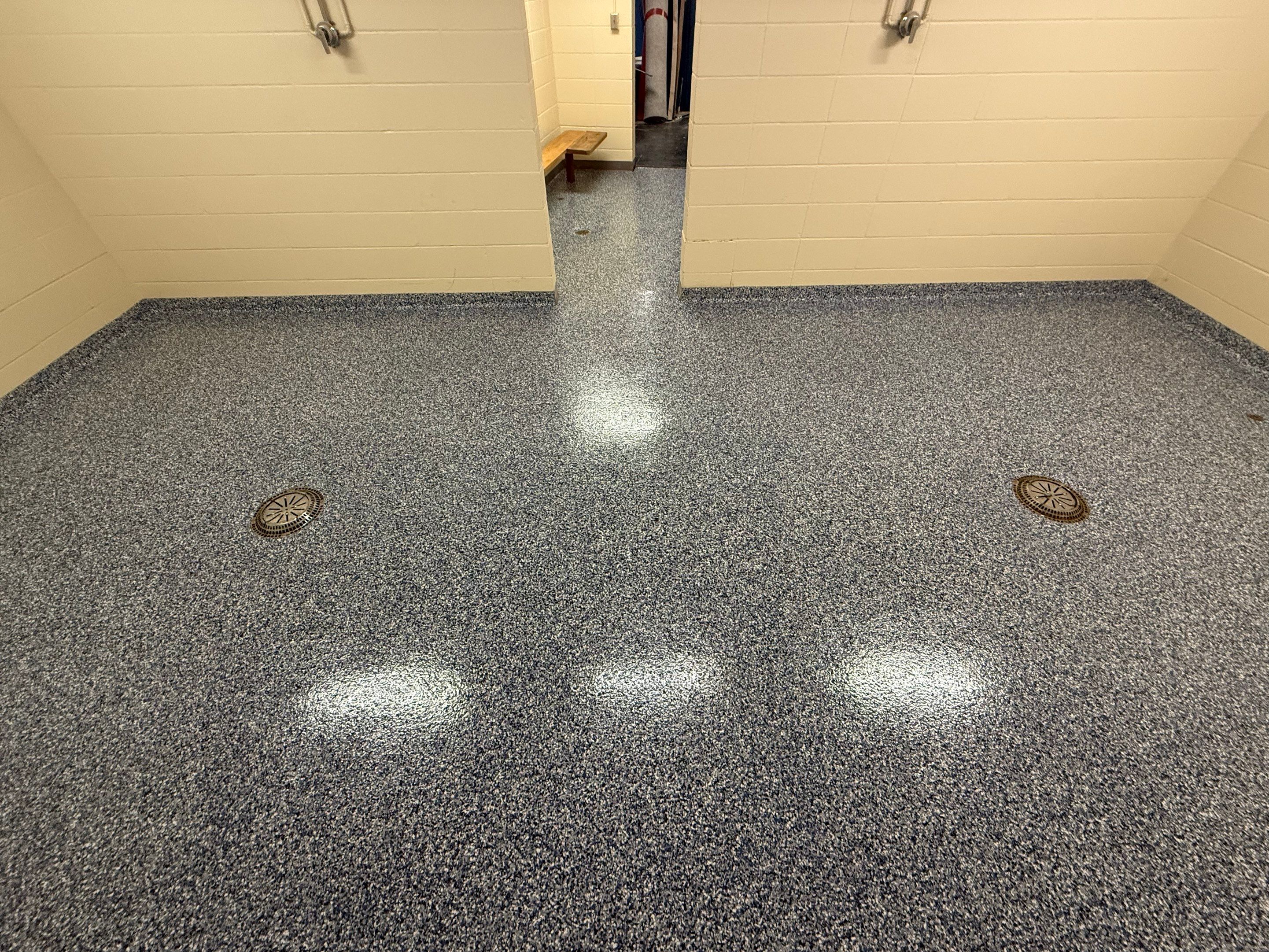 Seamless Epoxy Floor Coating at the Sioux Falls Canaries Facility by Select Painting, Coatings & Garage Cabinets