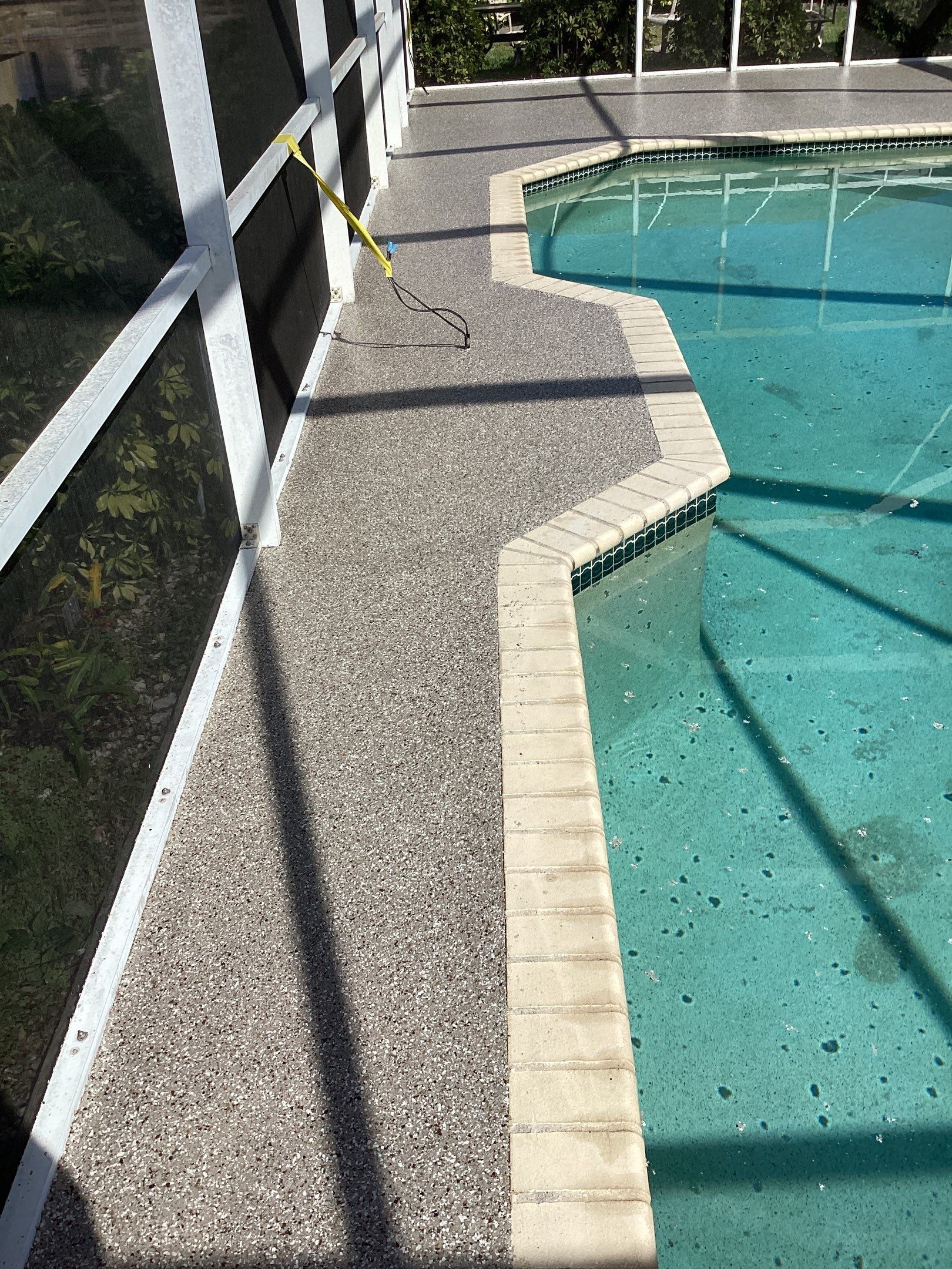 Patio using Pebble Beach by Amvet concrete coatings llc