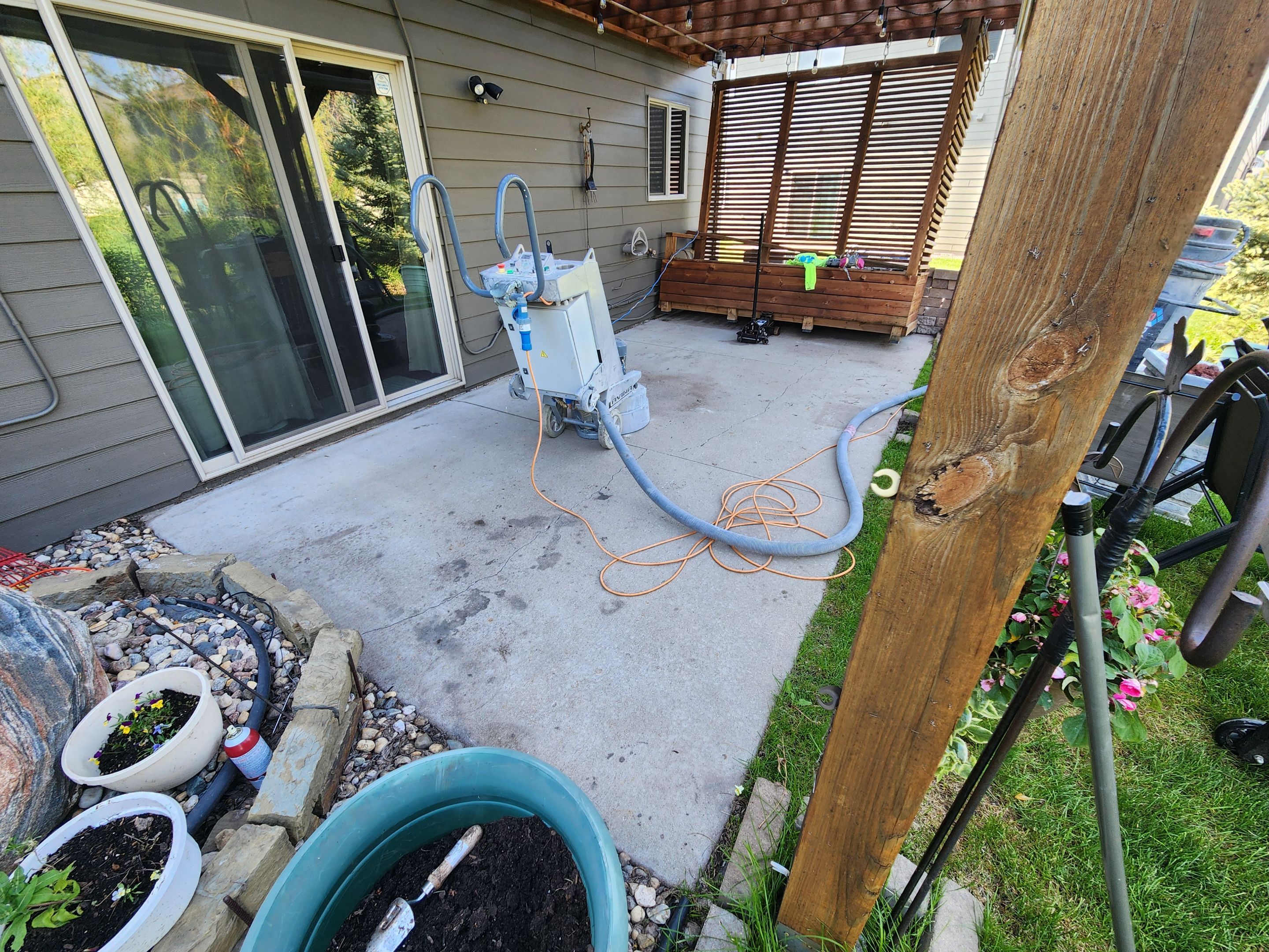 Coyote Flake Concrete Coating for Sioux Falls Patio by Select Painting, Coatings & Garage Cabinets